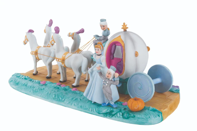 A "Cinderella " Figurine with Pumpkin Coach.