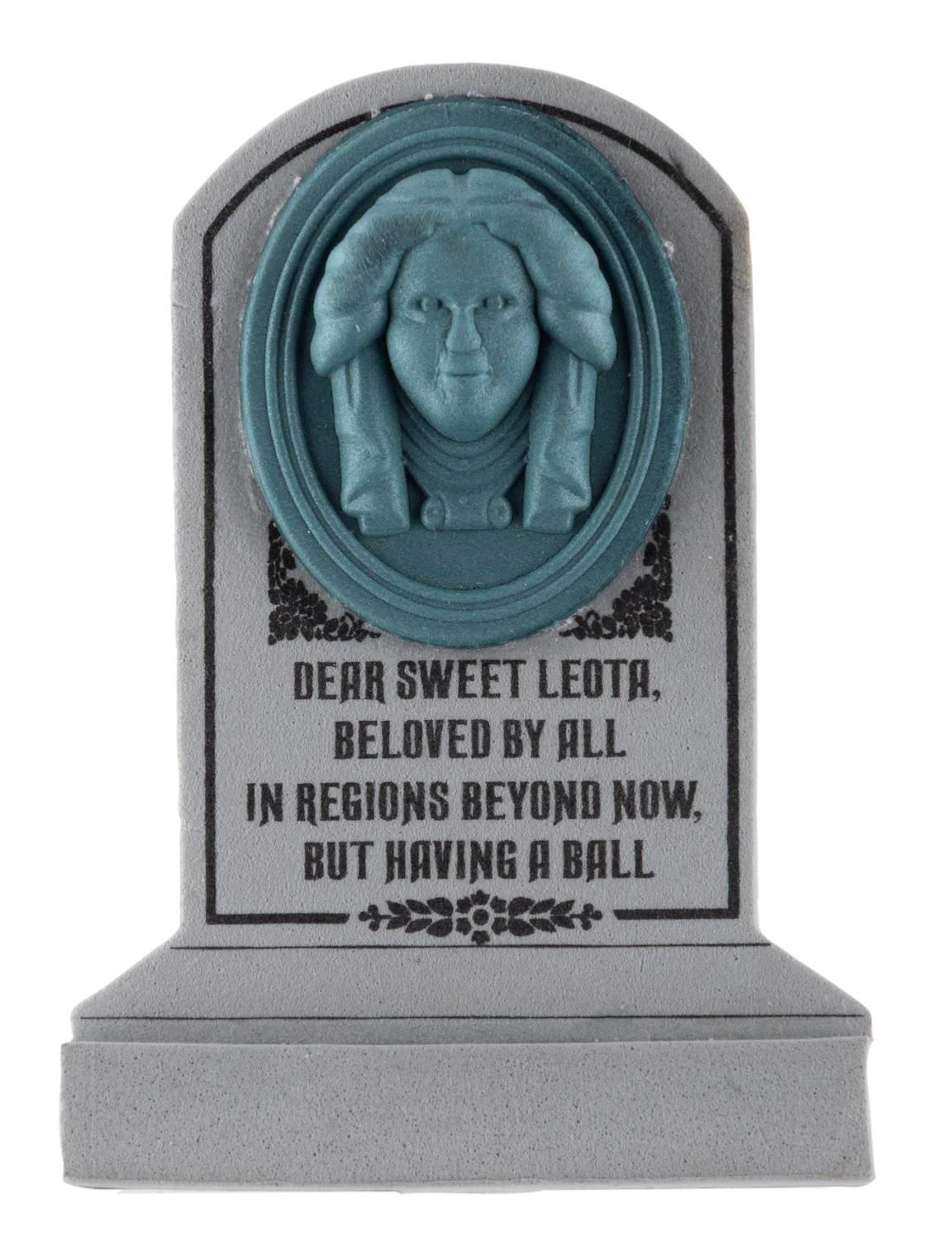 A Haunted Mansion Leota Tombstone Antenna Topper.
