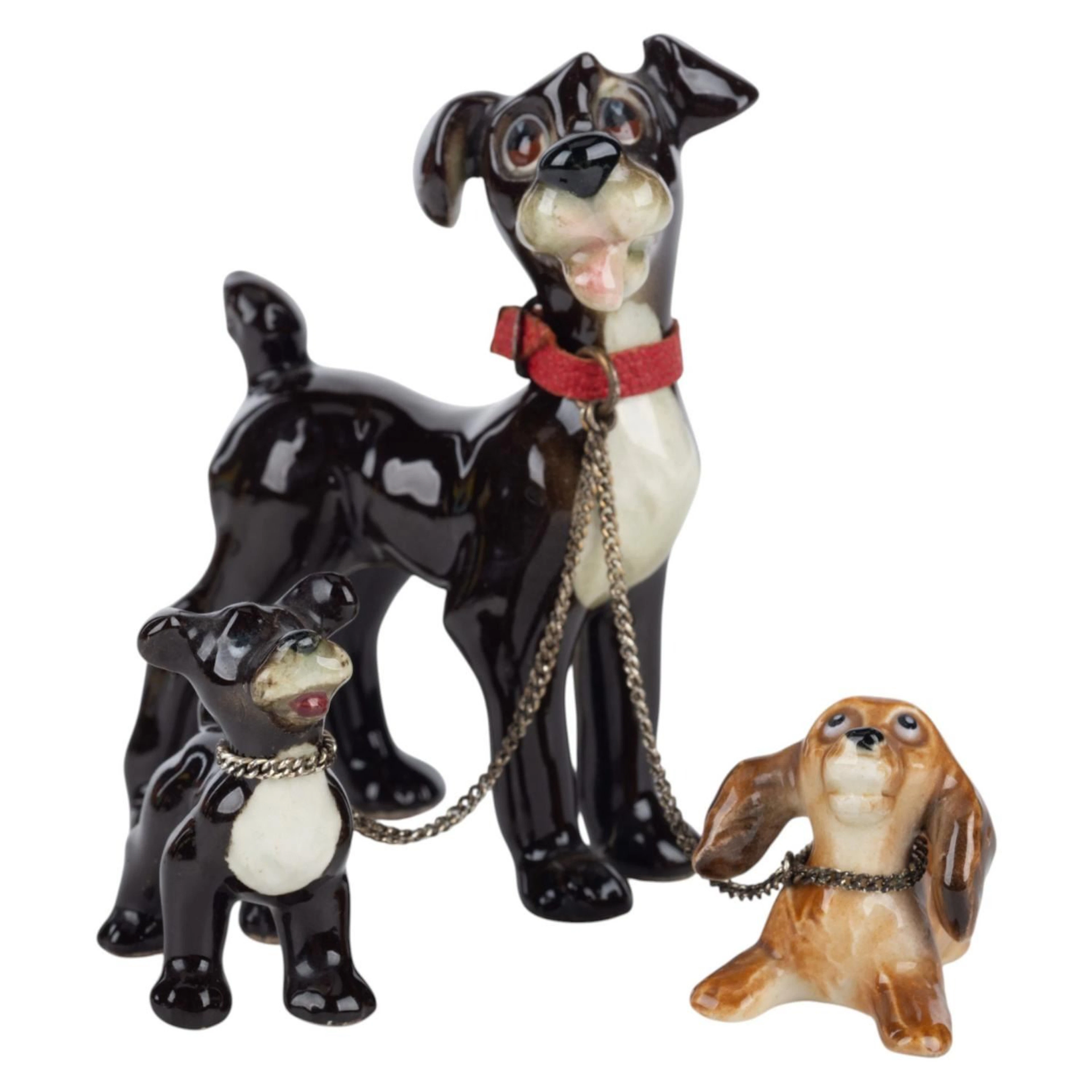 A Tramp with Puppies Ceramic Figurine Set by Goebel.