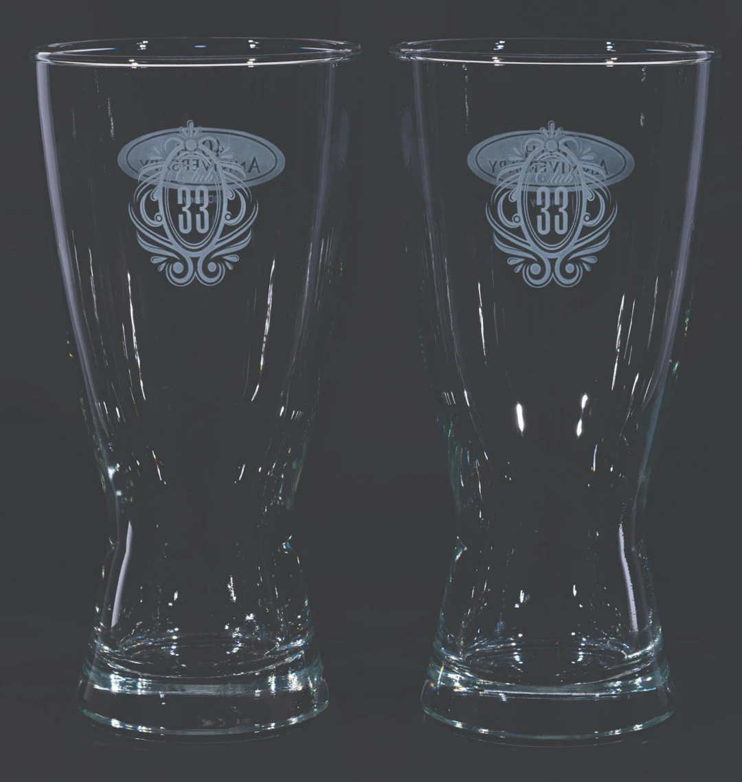 A Pair of Club 33 40th Anniversary Beer Glasses.