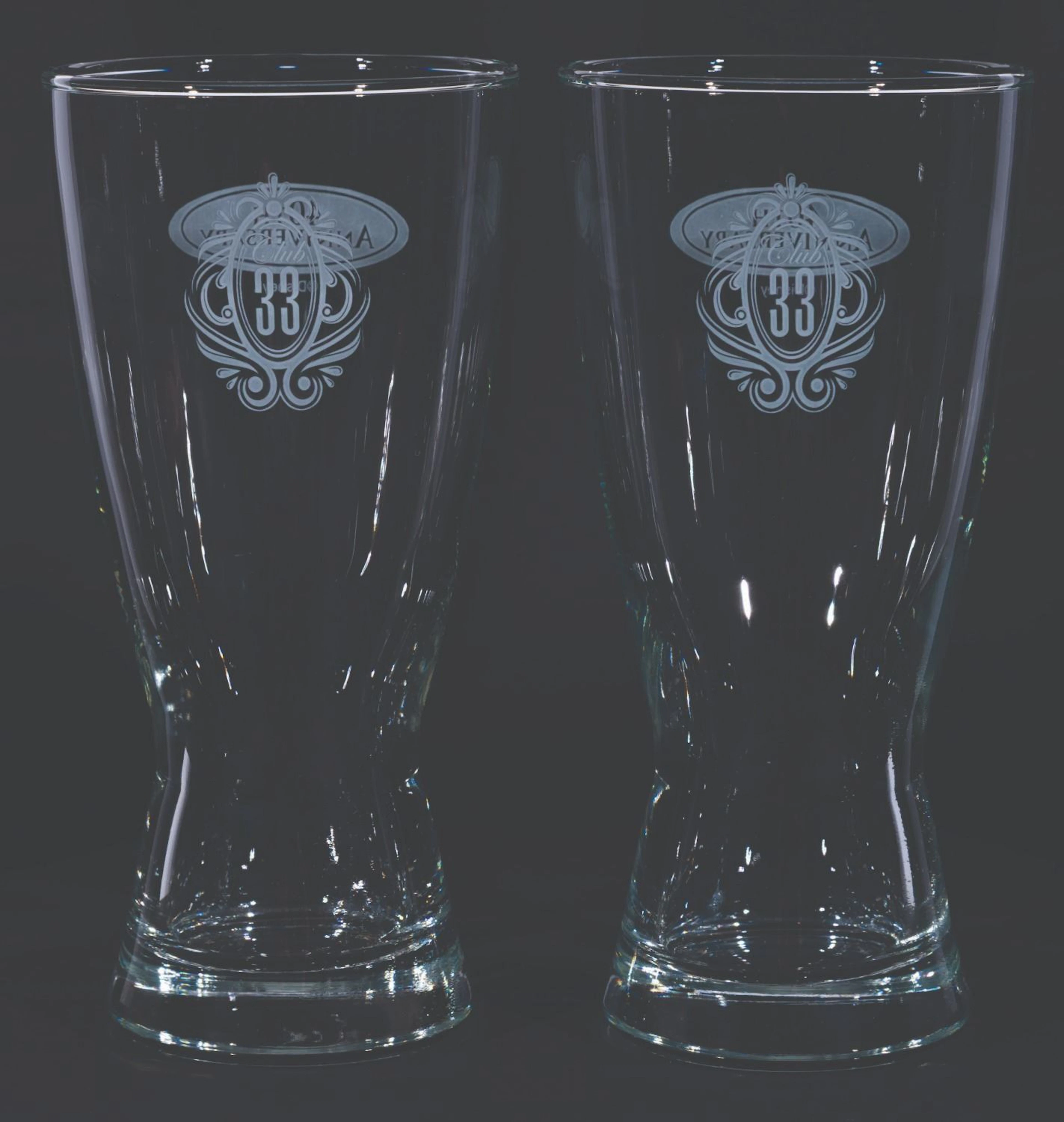 A Pair of Club 33 40th Anniversary Beer Glasses.