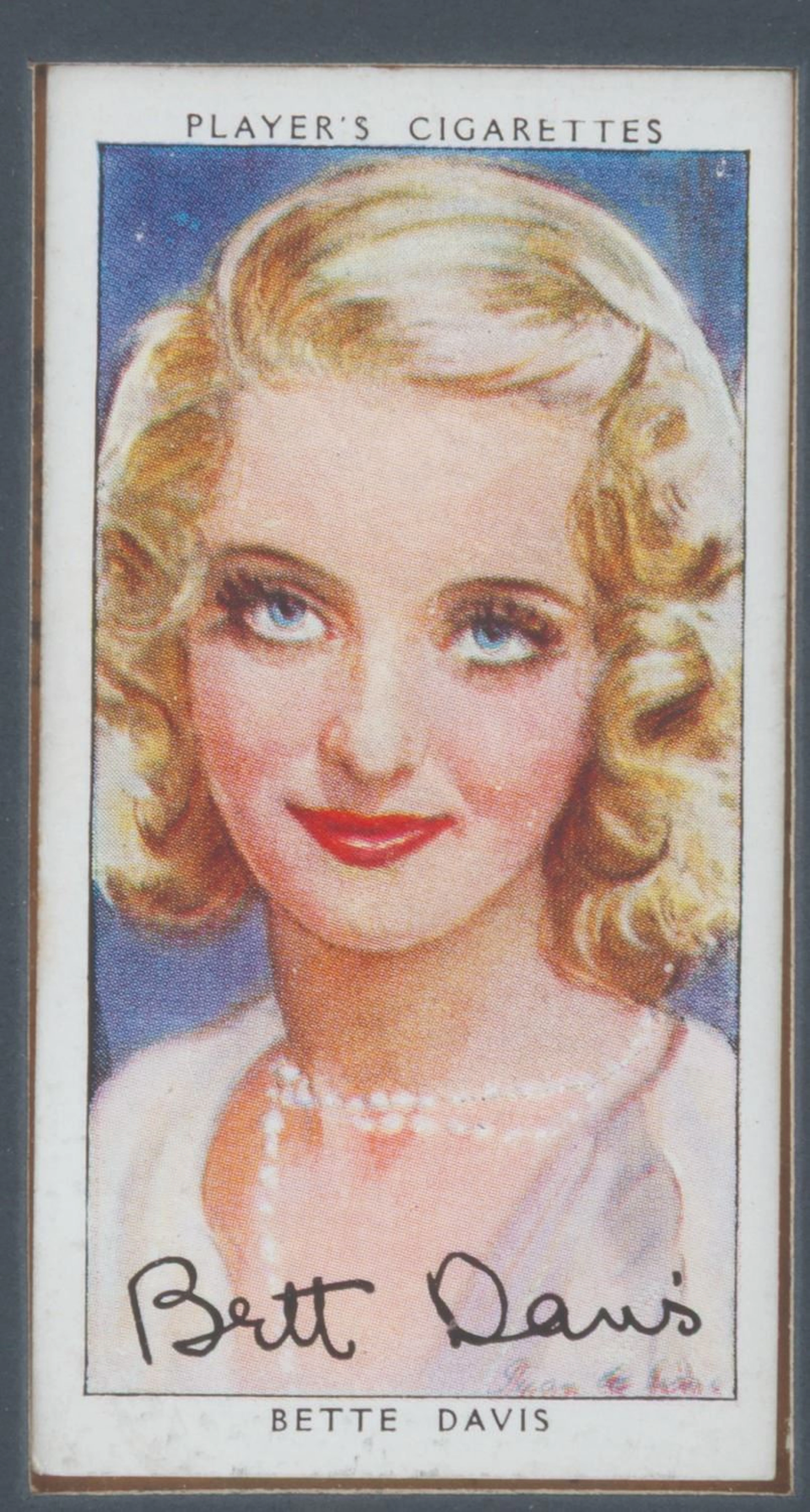 A Framed Bette Davis Player's Cigarette Card.