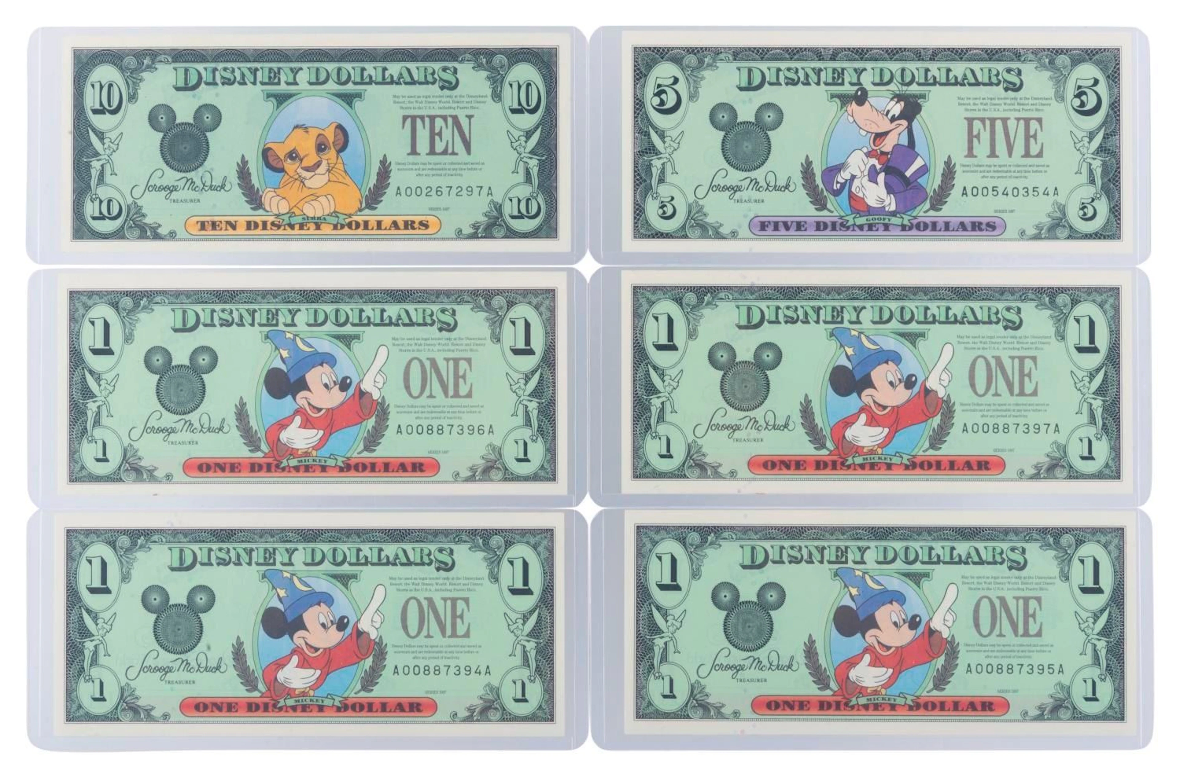 The Disneyland 1997 AA Series $1, $5, and $10 Bills.