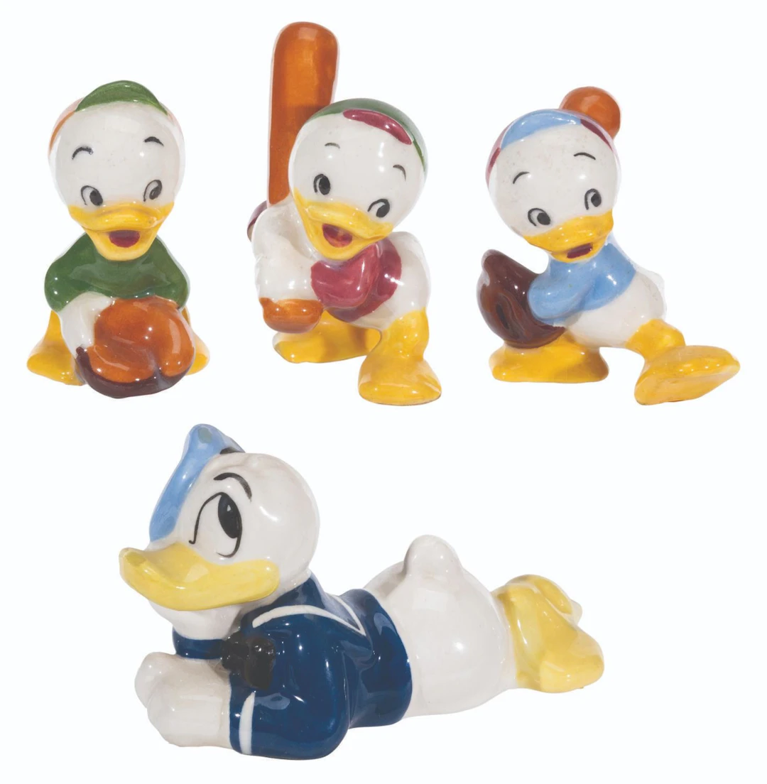 A Collection of Evan K. Shaw Donald Duck and Nephew Figurines.