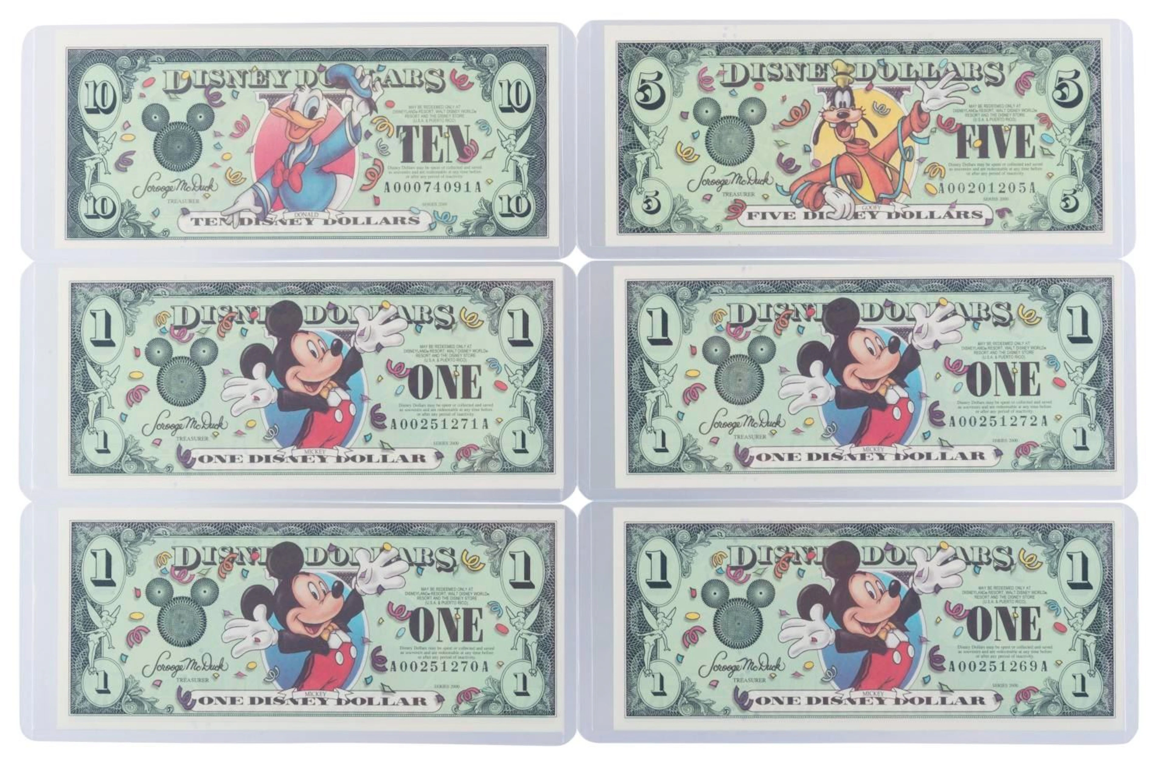 The Disneyland 2000 AA Series $1, $5, and $10 Bills.