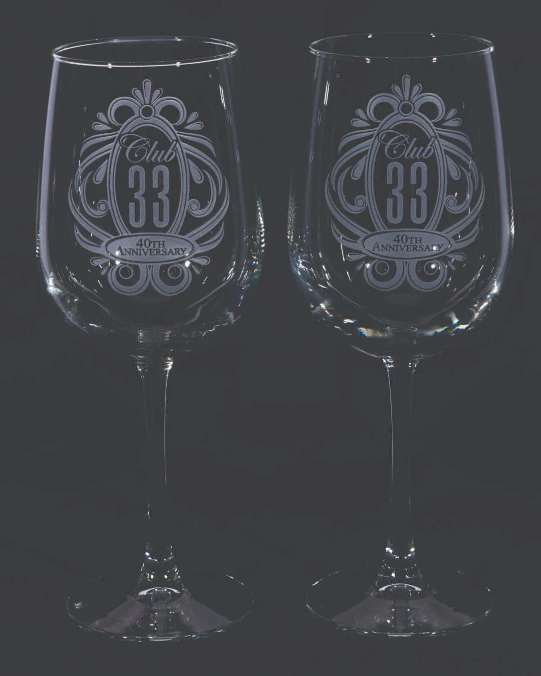A Pair of Club 33 40th Anniversary Wine Glasses.