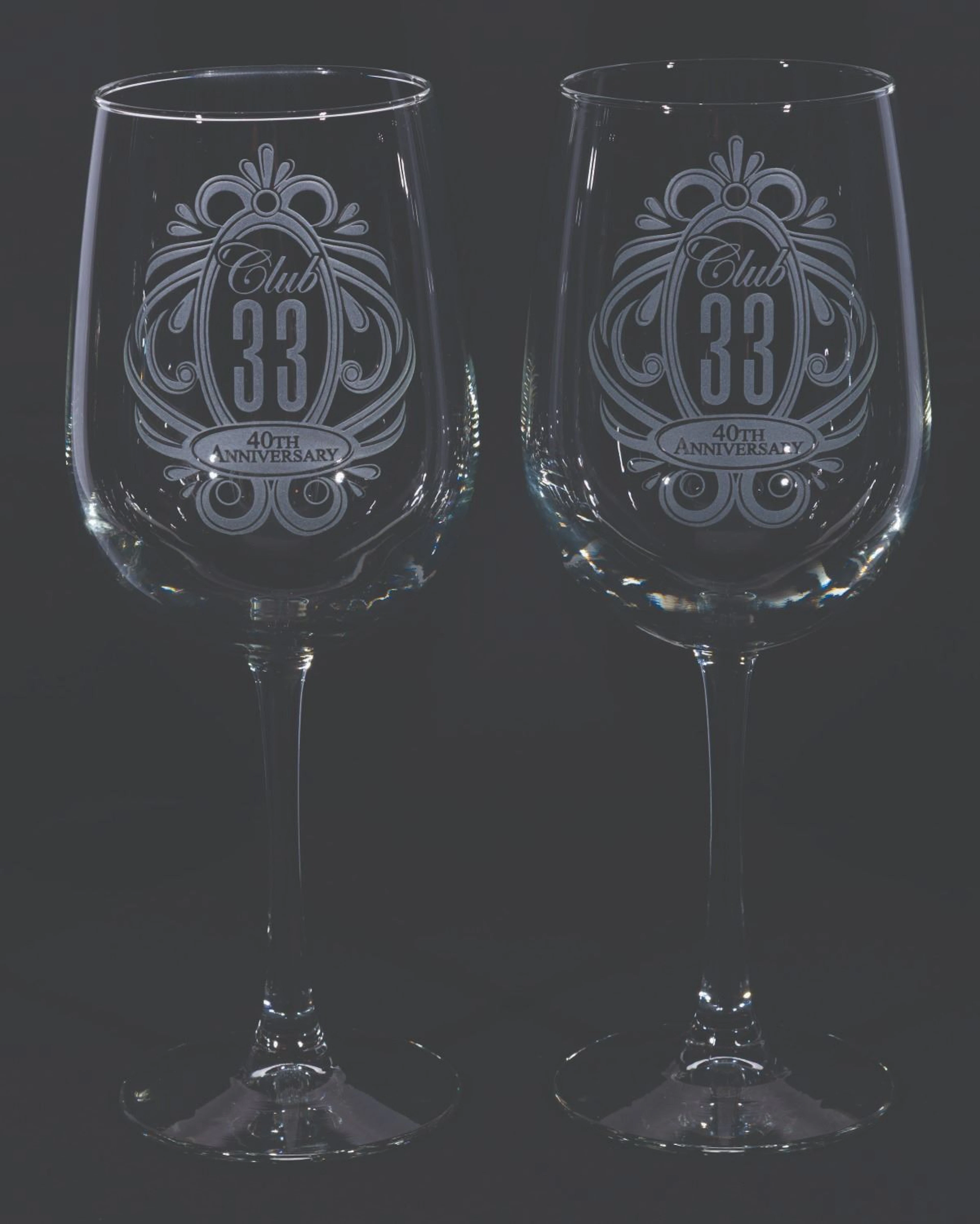 A Pair of Club 33 40th Anniversary Wine Glasses.