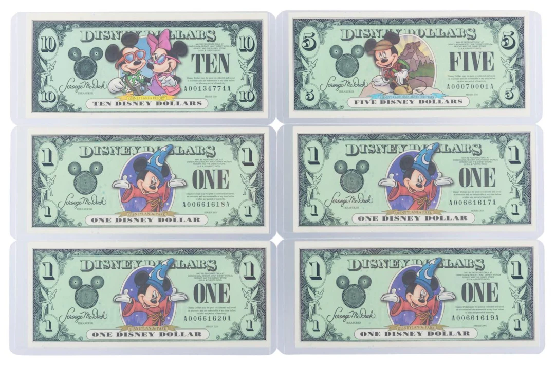The Disneyland 2001 AA Series $1, $5, and $10 Bills.