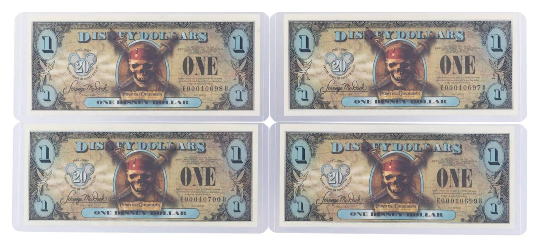 The 2007 Disney Dollars 20th Anniversary Black Pearl Series $1 Bills.