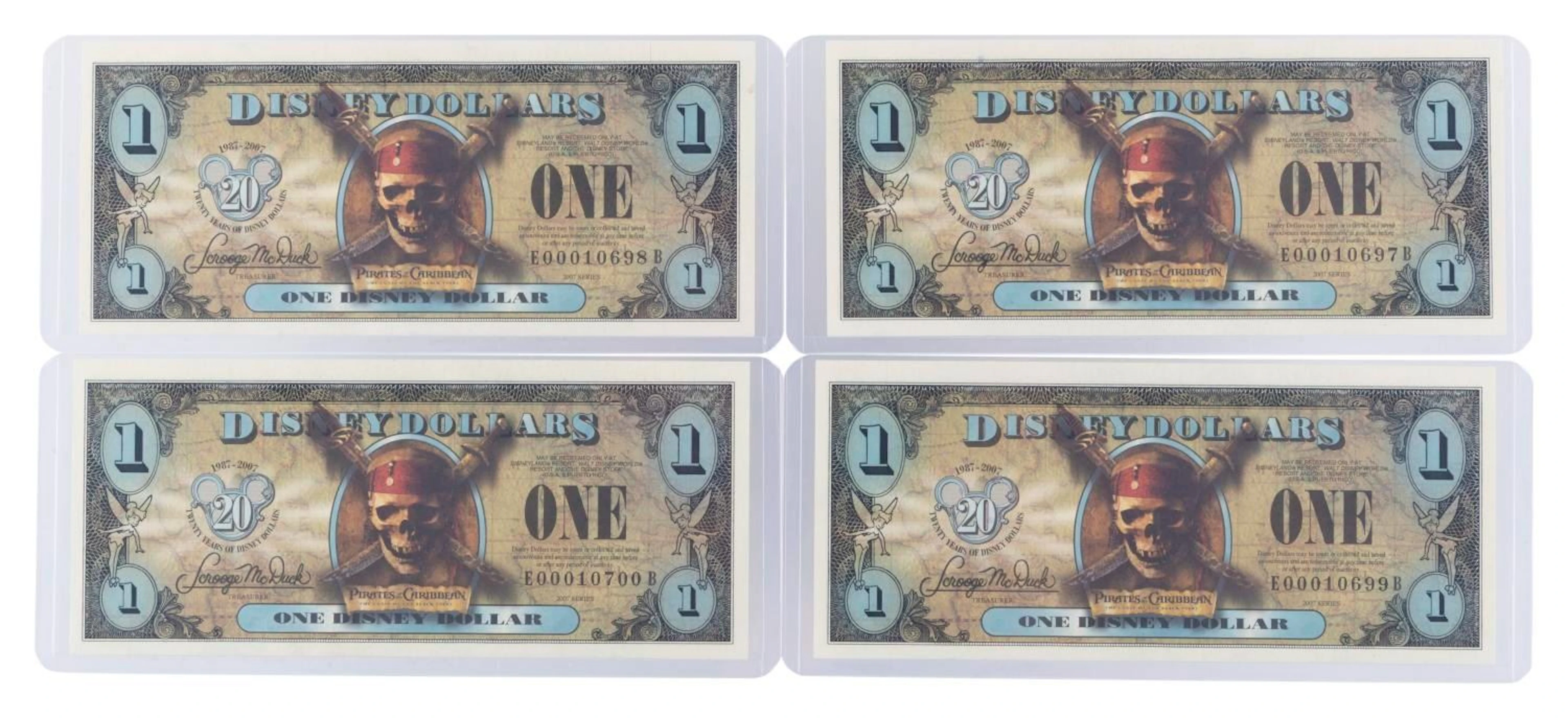 The 2007 Disney Dollars 20th Anniversary Black Pearl Series $1 Bills.