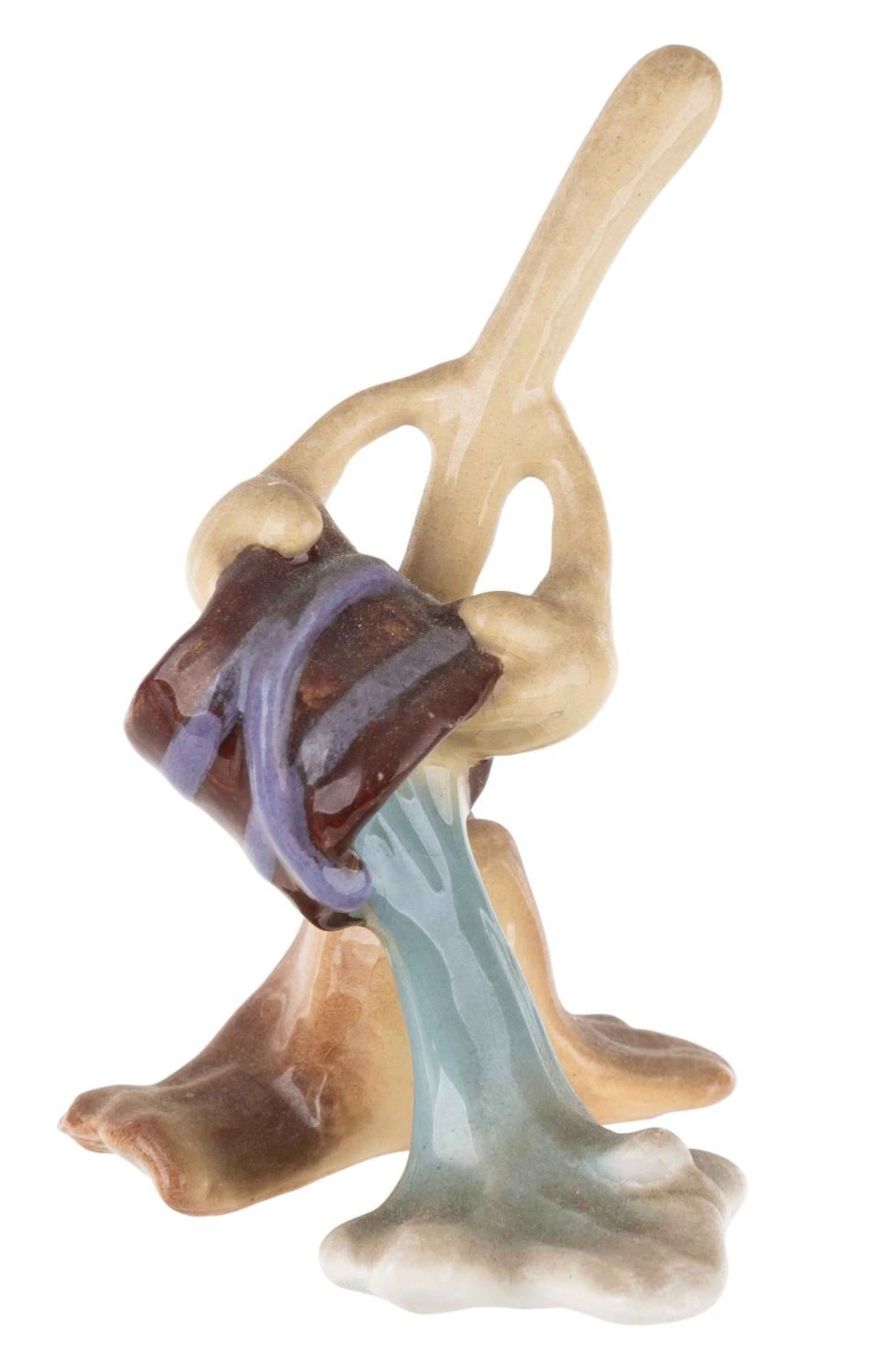 A "Fantasia" Enchanted Broom Ceramic Figurine.