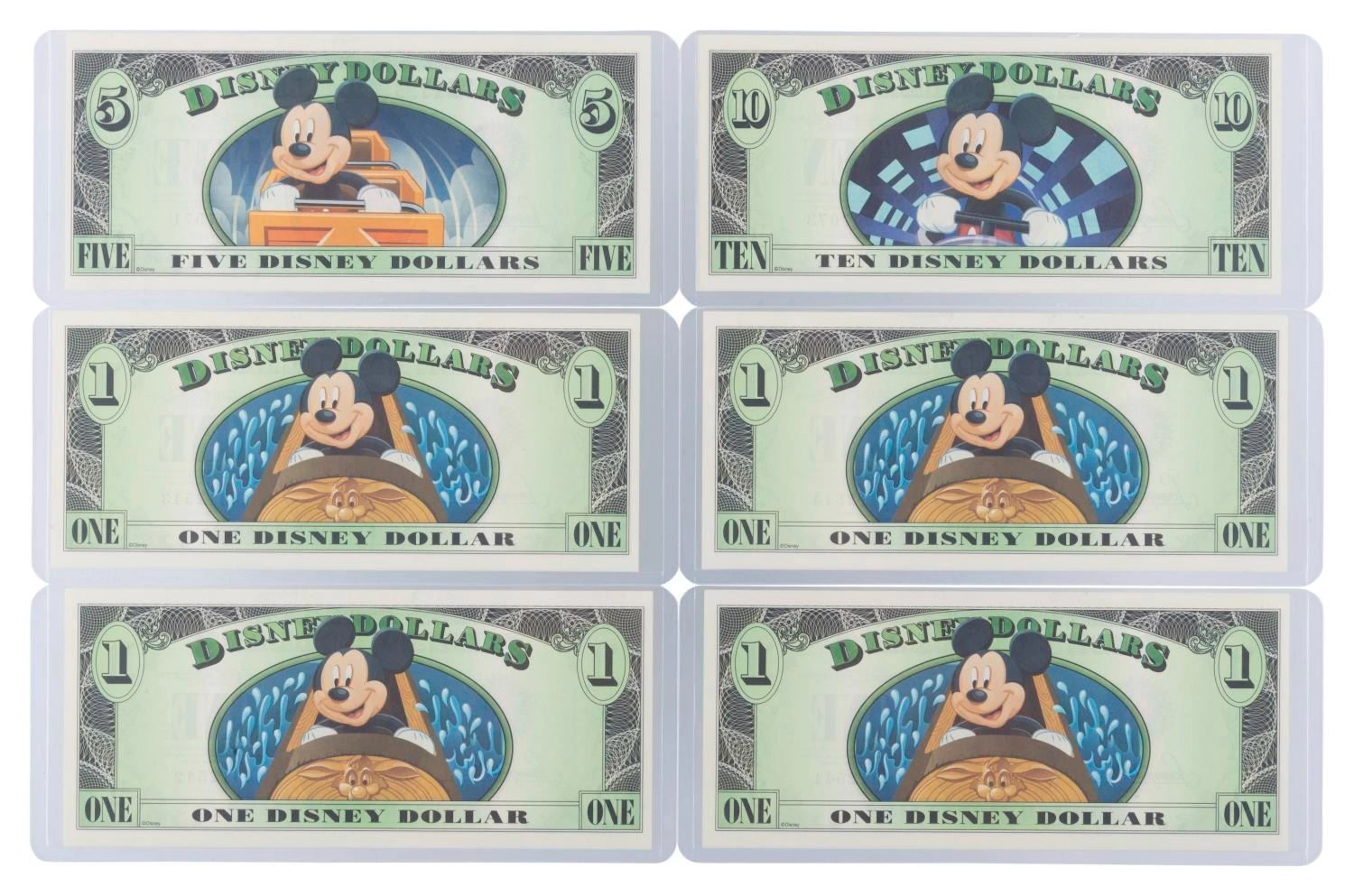 The 2014 Disney Dollars Mountains of Disney Series $1, $5, and $10 Bills.