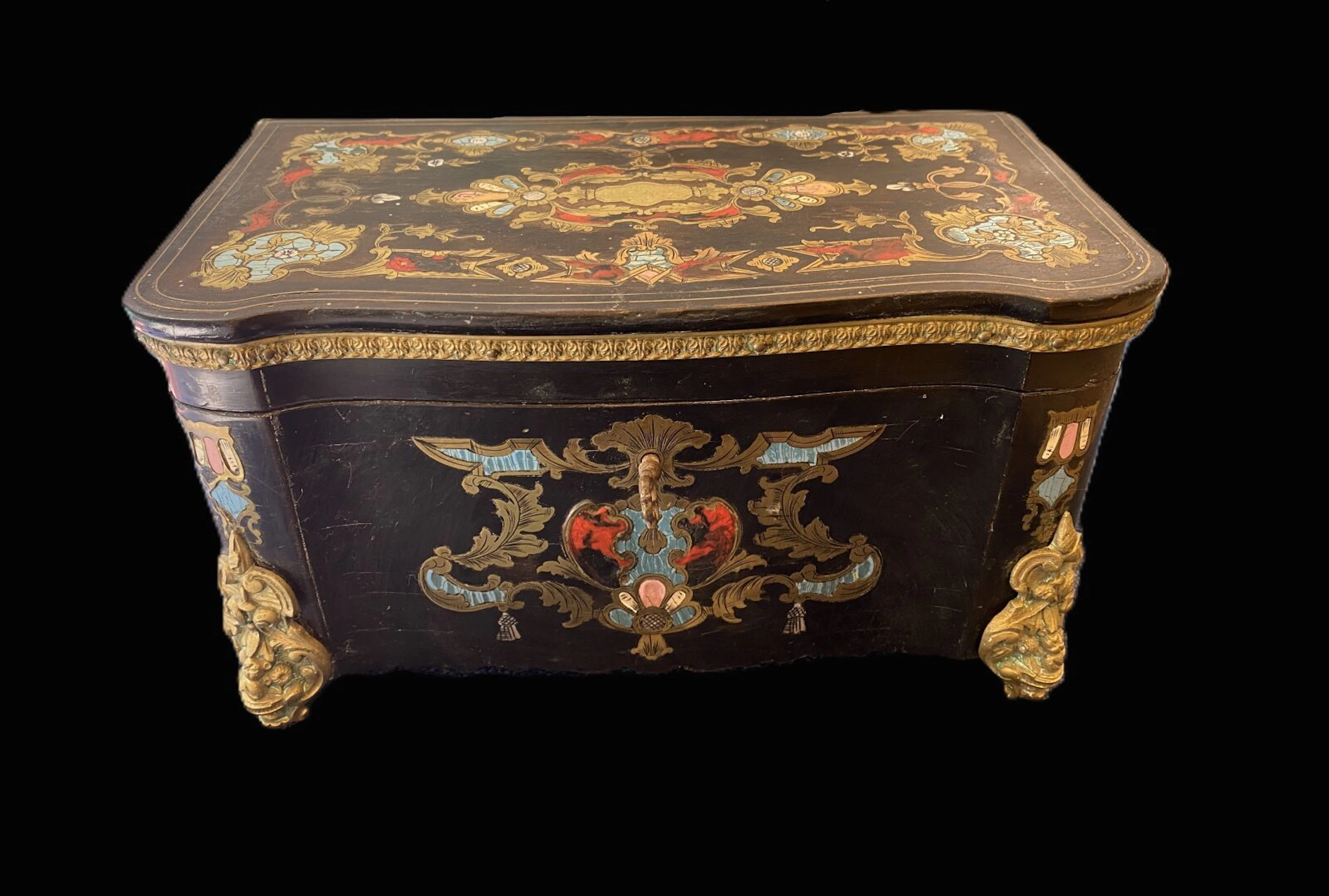 Tea box in blackened wood, polychrome marquetry and brass. N - Lot 109