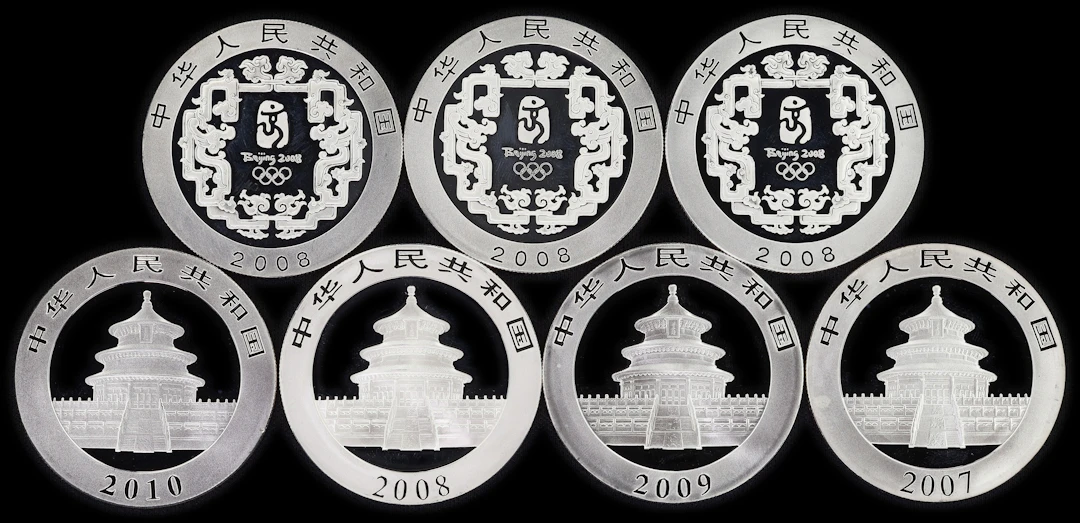 (7 oz, 217.728 g ASW). China. Lot of (7) Mixed Date 1 oz Silver 10 Yuan.