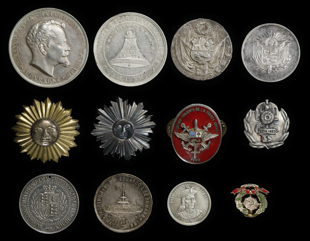 PERU. Group of Mostly Silver Medals and Pins (12 Pieces), 1874-1958.