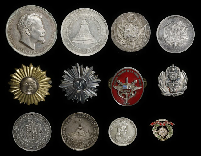 PERU. Group of Mostly Silver Medals and Pins (12 Pieces), 1874-1958.