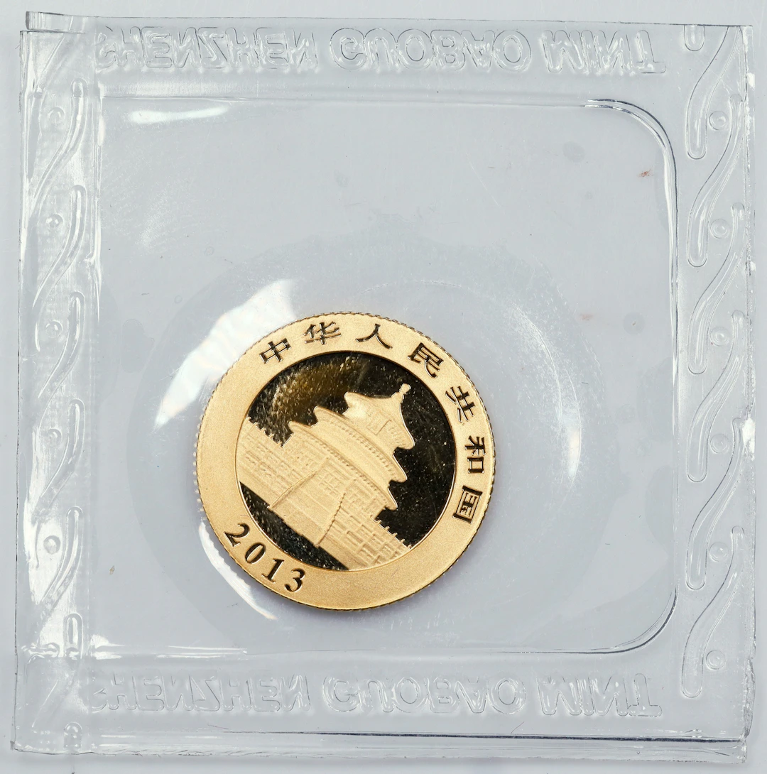 (0.1 oz, 3.11 g AGW). China. 2013 1/10 oz Gold Panda.