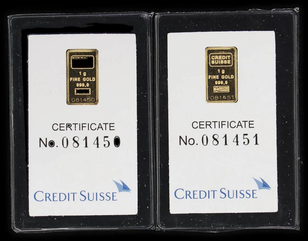 (0.064 oz, 2 g AGW). Lot of (2) Credit Suisse 1 gram Gold Bars.