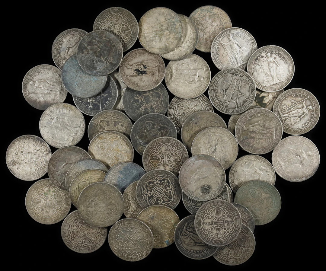 GREAT BRITAIN. Group of Trade Dollars (51 Pieces), 1910-30. Average
