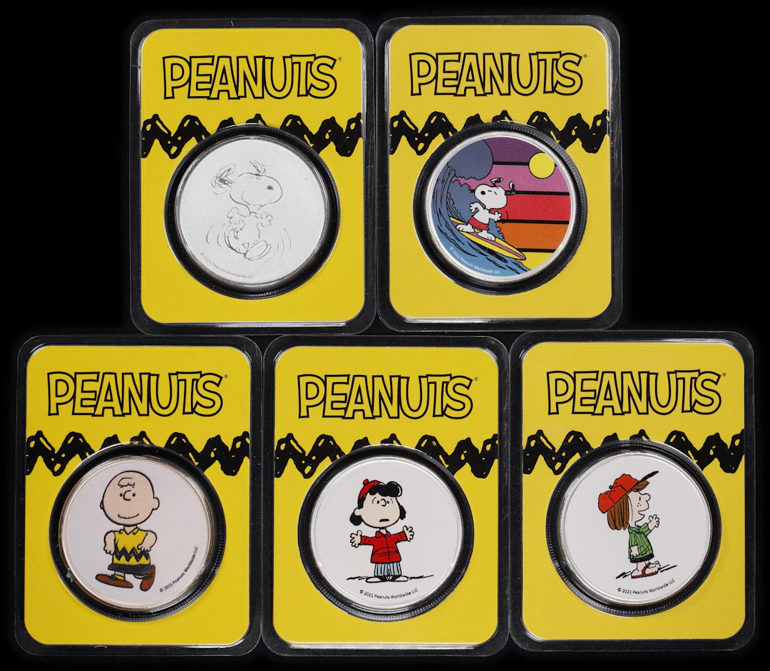 (5 oz, 155.52 g ASW). Lot of (5) Peanuts Assorted Design 1 oz Silver Rounds.
