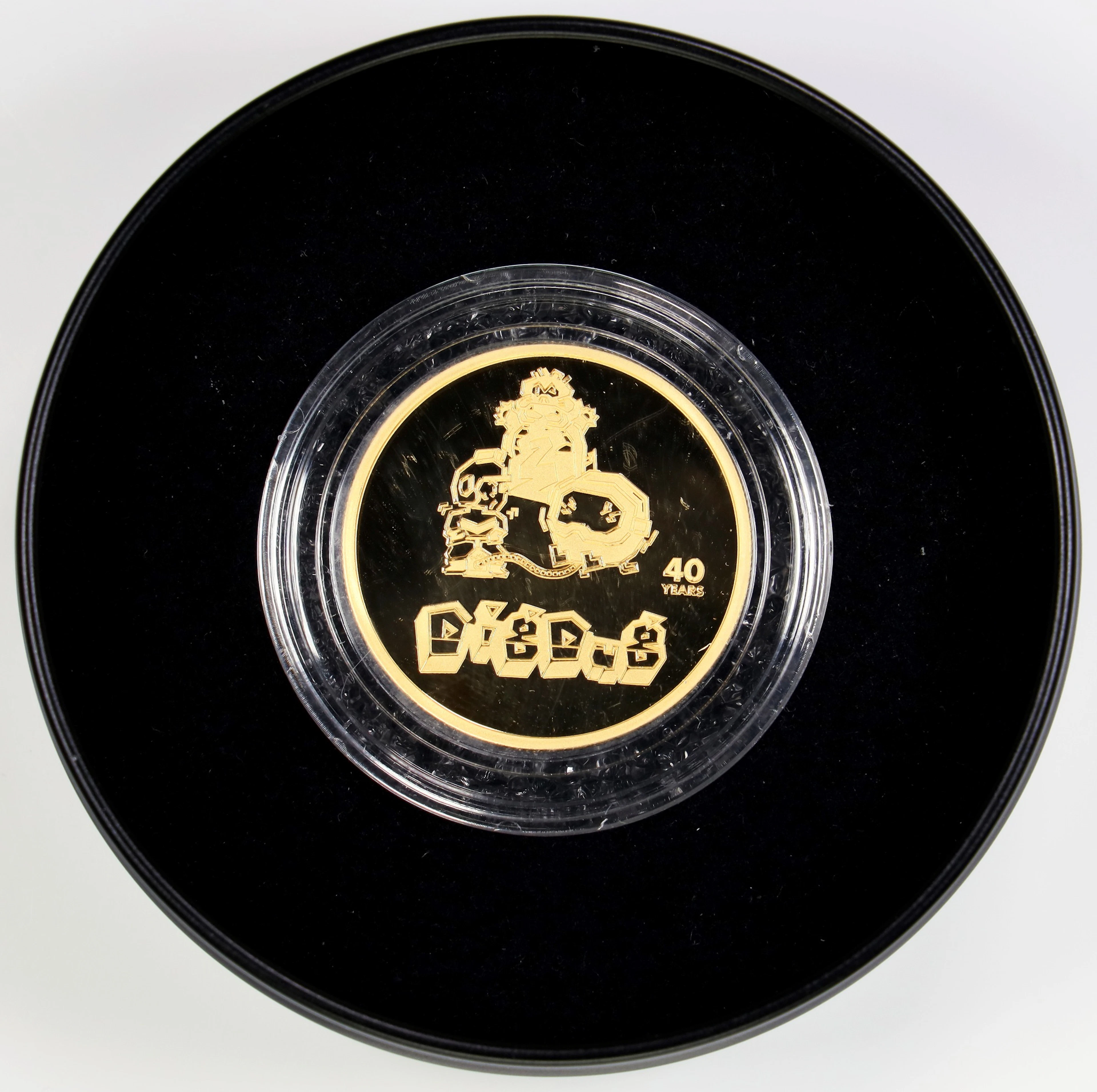 (1 oz, 31.104 g AGW). Dig Dug 40th Anniversary 1 oz Gold Round.