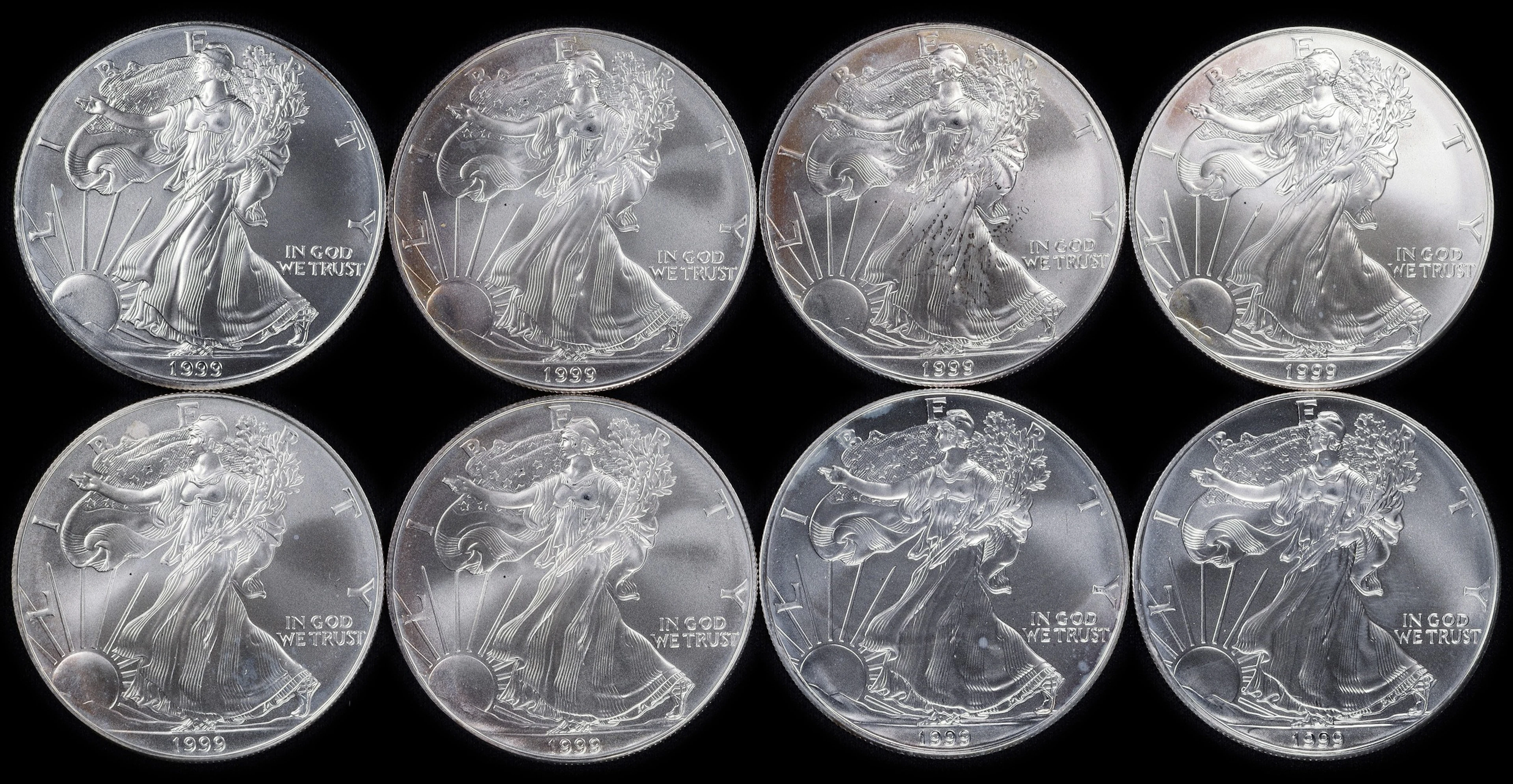 (8 oz, 248.832 g ASW). Lot of (8) 1999 American Silver Eagles.