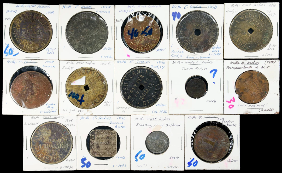 NETHERLANDS EAST INDIES. Group of Plantation Tokens (14 Pieces), 1888-1918.