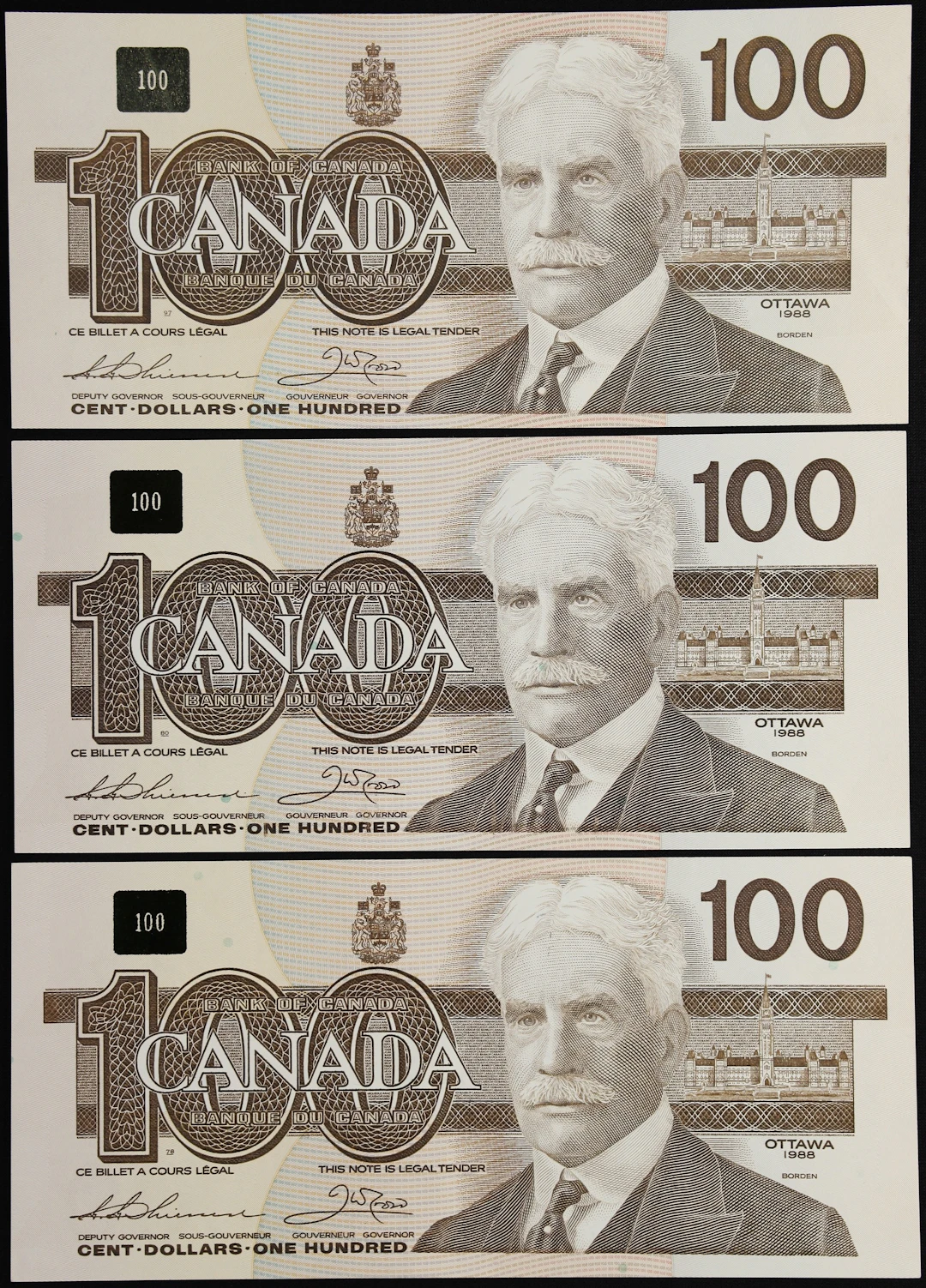 CANADA--BANK OF CANADA. Lot of (3). Bank of Canada. 100 Dollars, 1988.