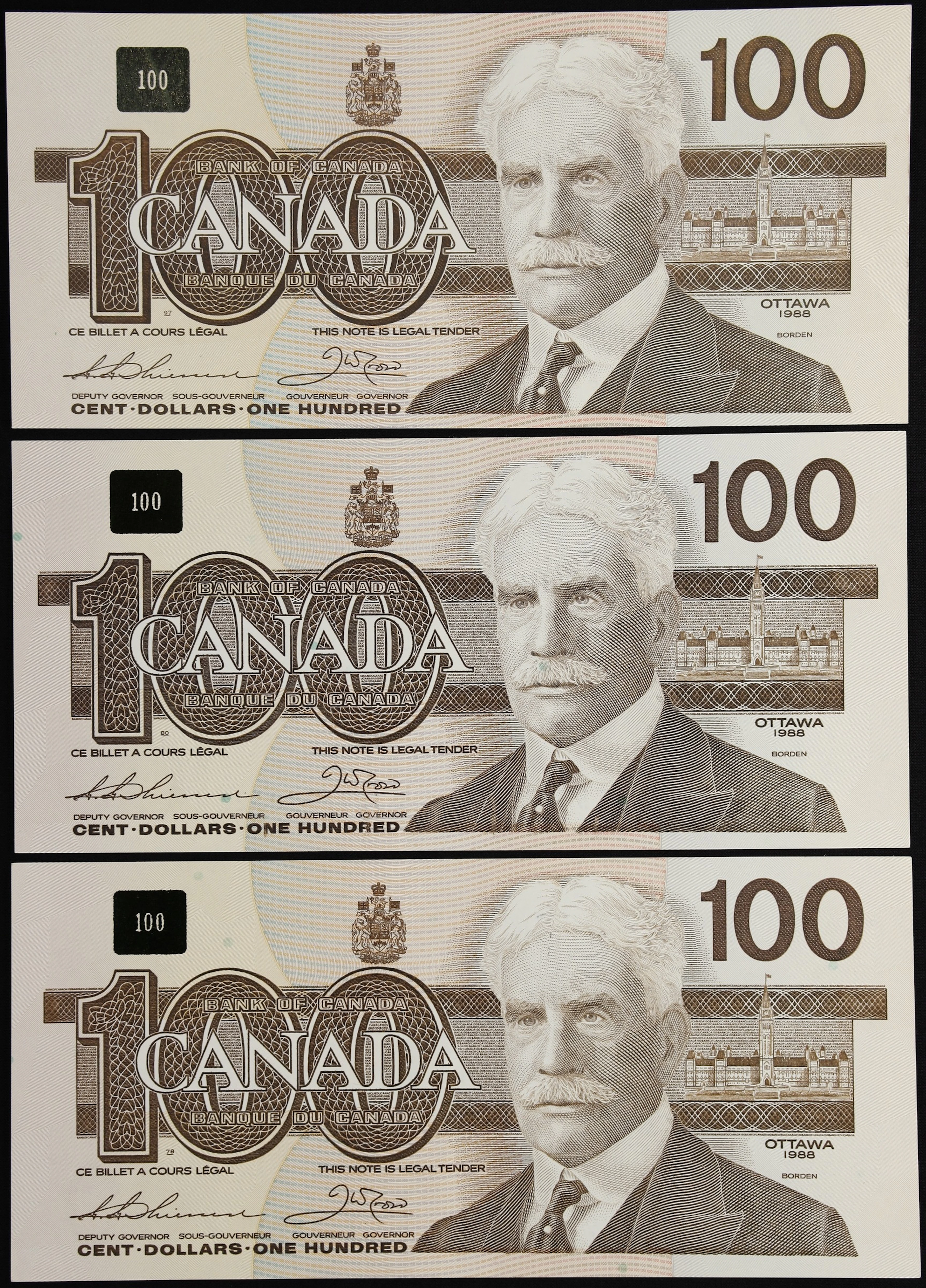 CANADA--BANK OF CANADA. Lot of (3). Bank of Canada. 100 Dollars, 1988.