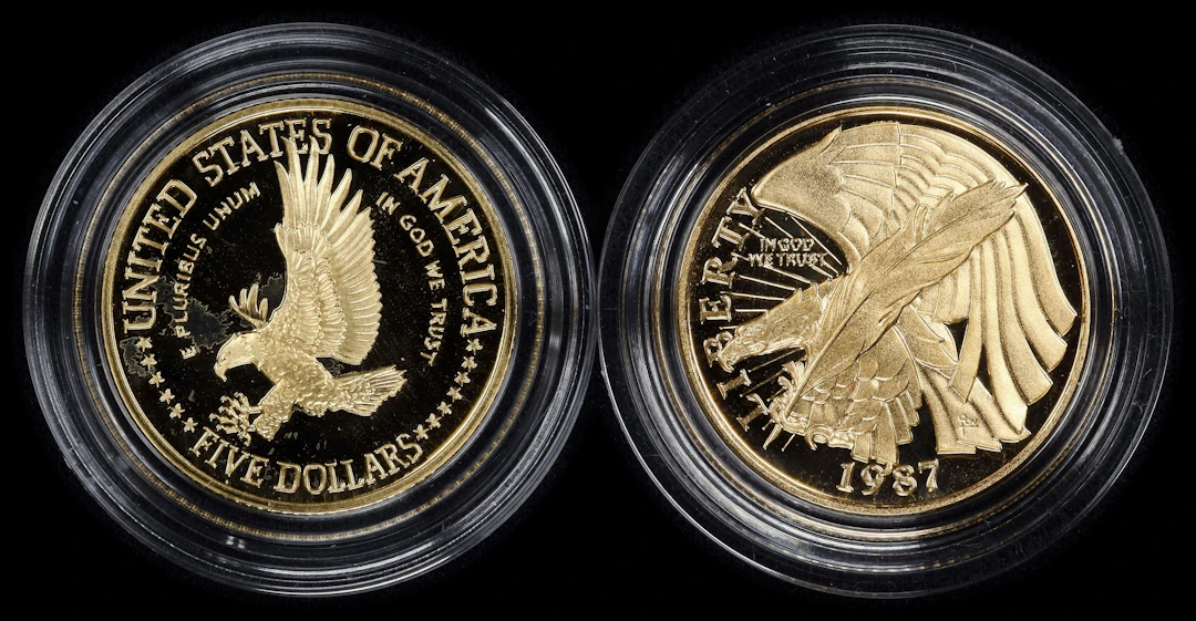 (0.484 oz, 15.054 g AGW). Lot of (2) Mixed Date U.S. Commemorative Gold $5.