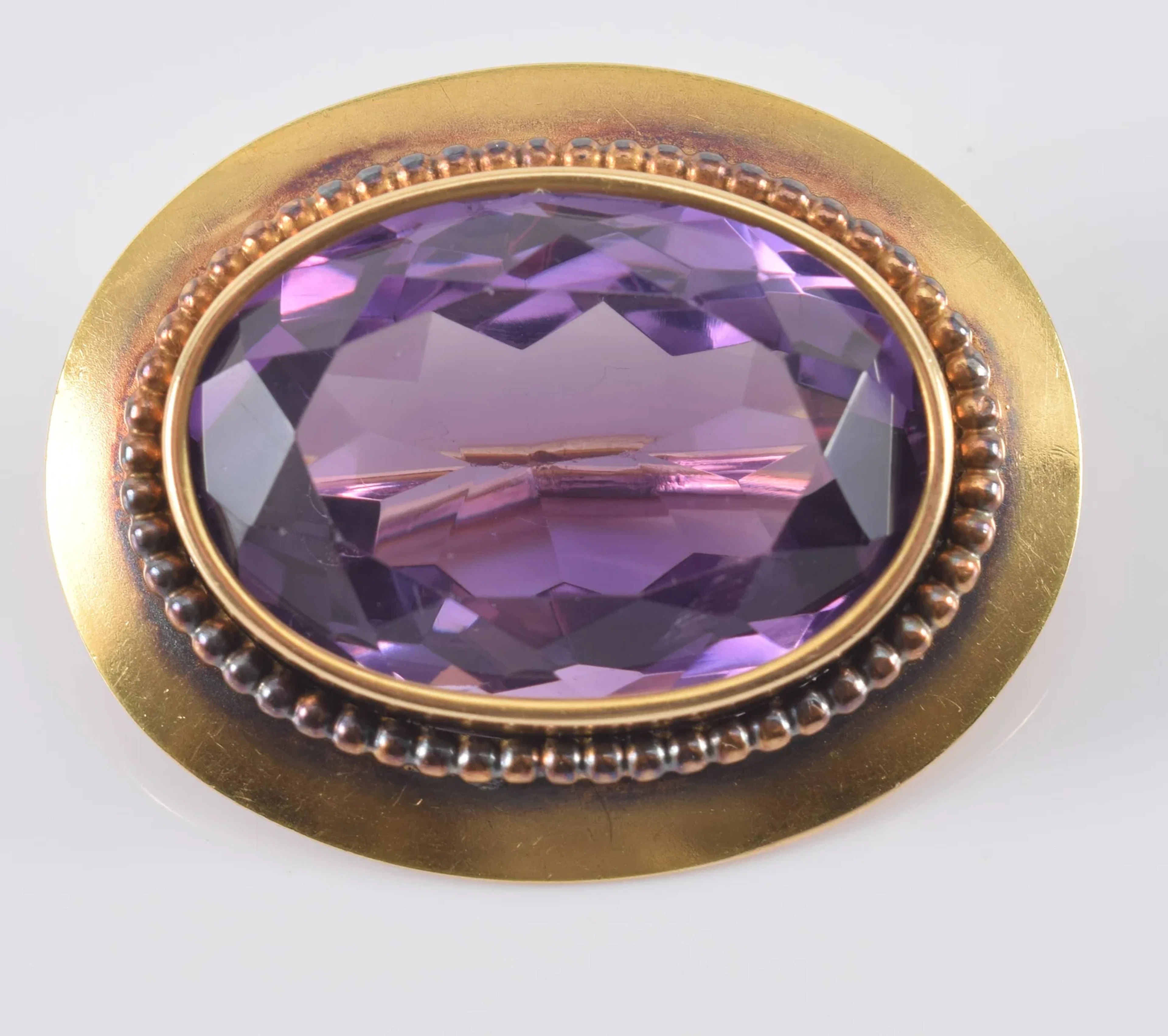Vintage 14K gold amethyst pin. Large oval cut amethyst stone measures