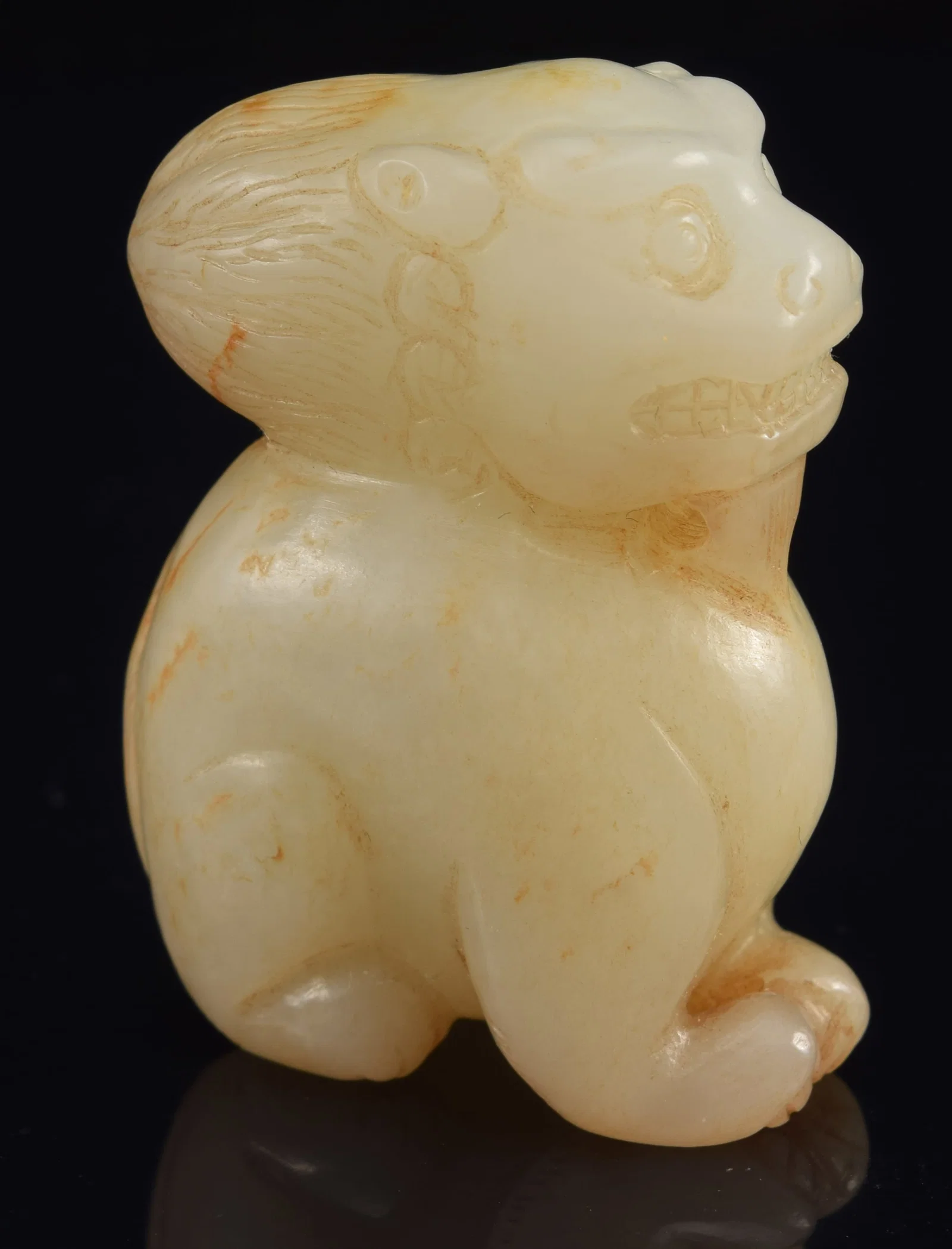 Jade carving of a buddhist lion. China. 19th century or earlier. Stone