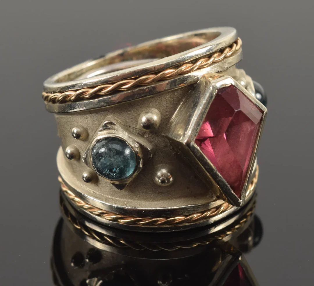 18K gold custom ring with pink and paraiba tourmalines. Faceted kite