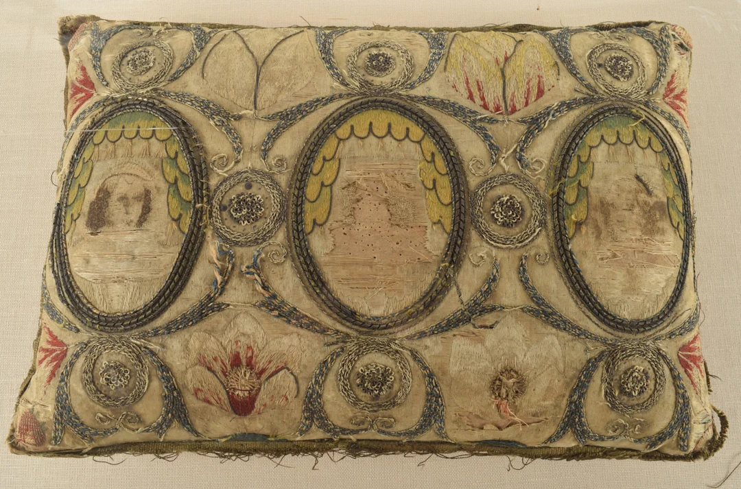 A rare English 17th or 18th Century embroidered and needlework cushion
