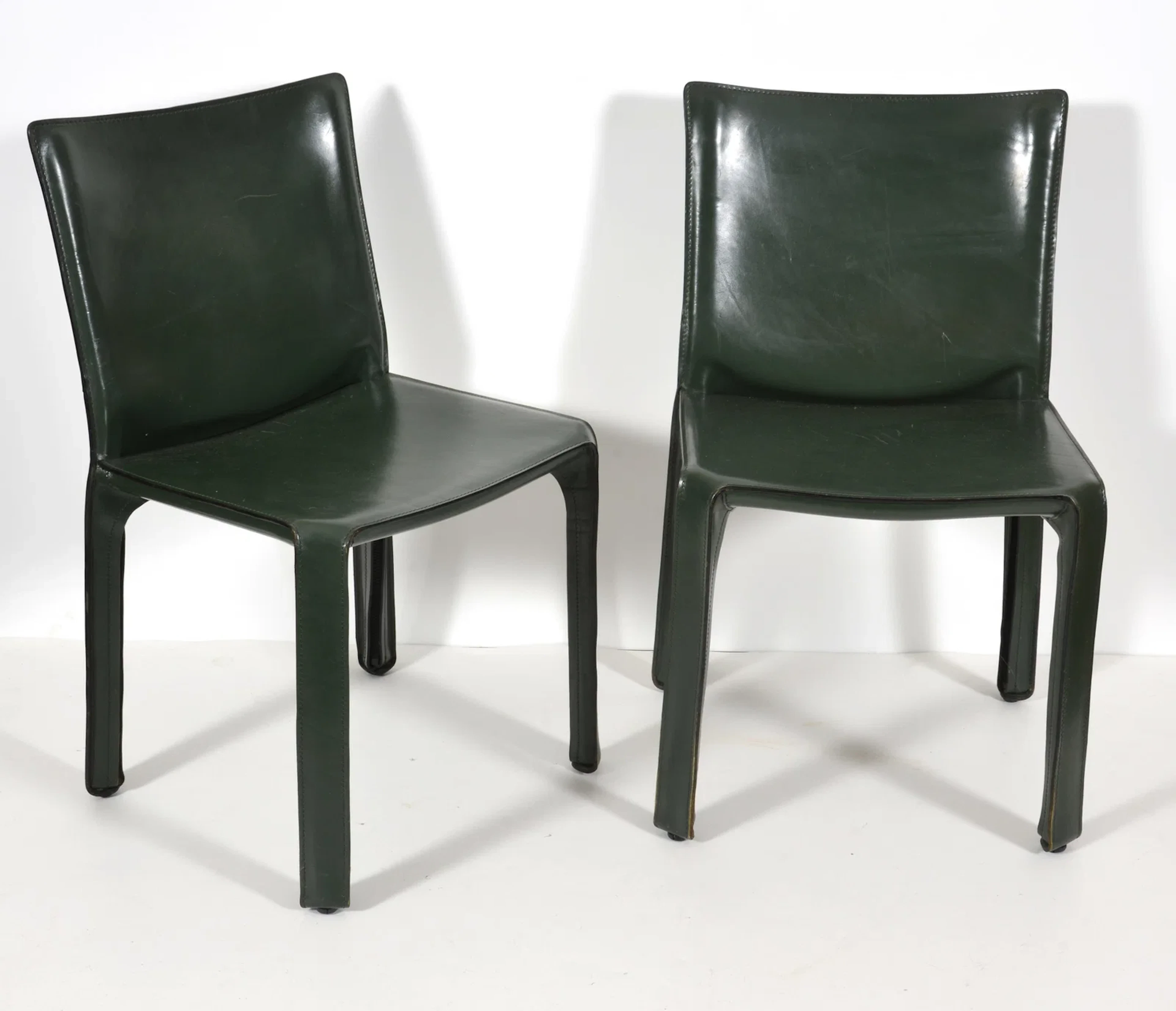 Pair of green leather Marco Bellini, Cassina dining chairs. Height