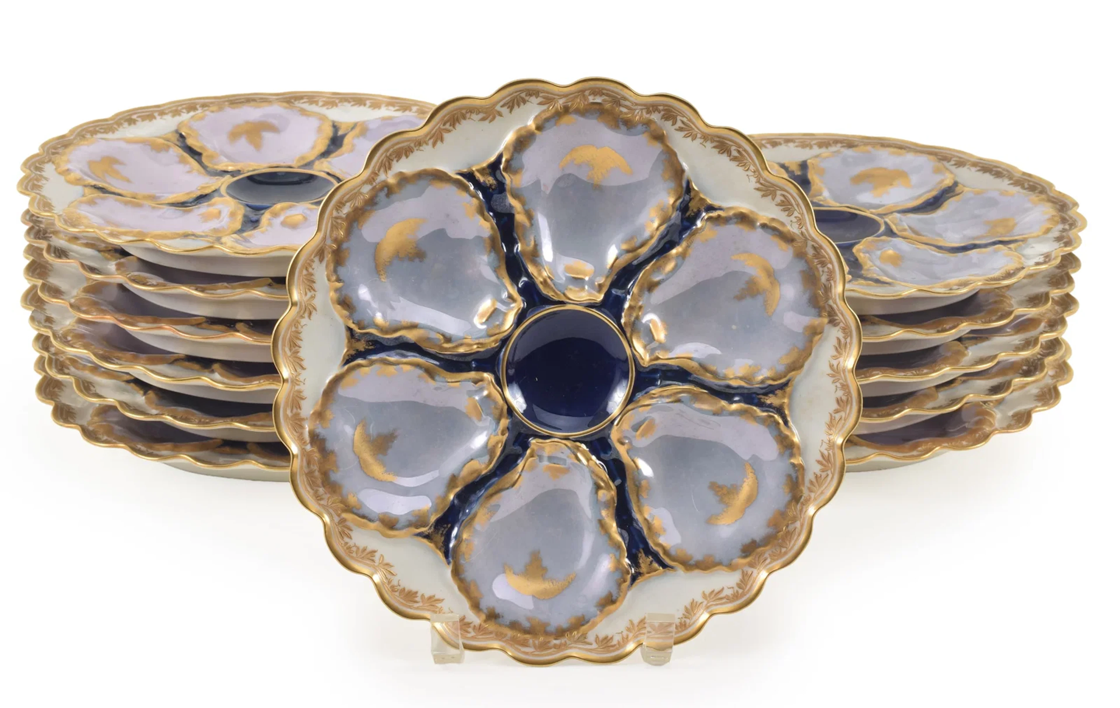 Set of 12 Haviland Limoges oyster plates with shaped edges and gilt