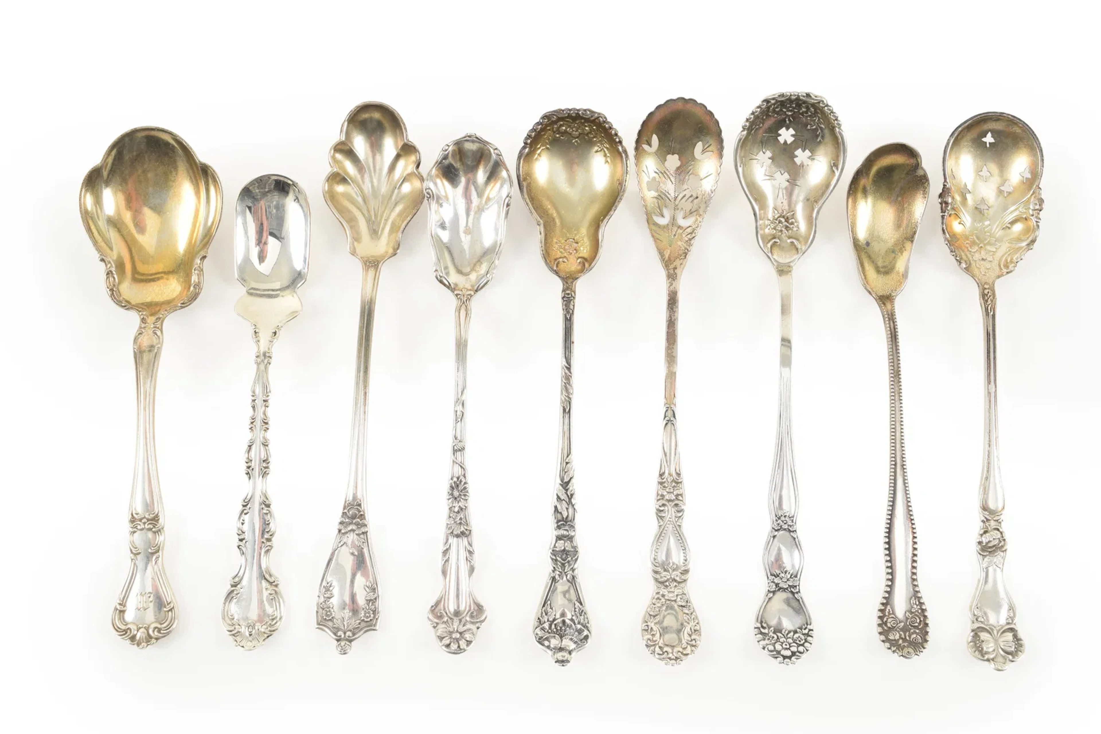 Collection of 9 Sterling silver serving spoons. Longest 6.5 in. 5.00 ozt.