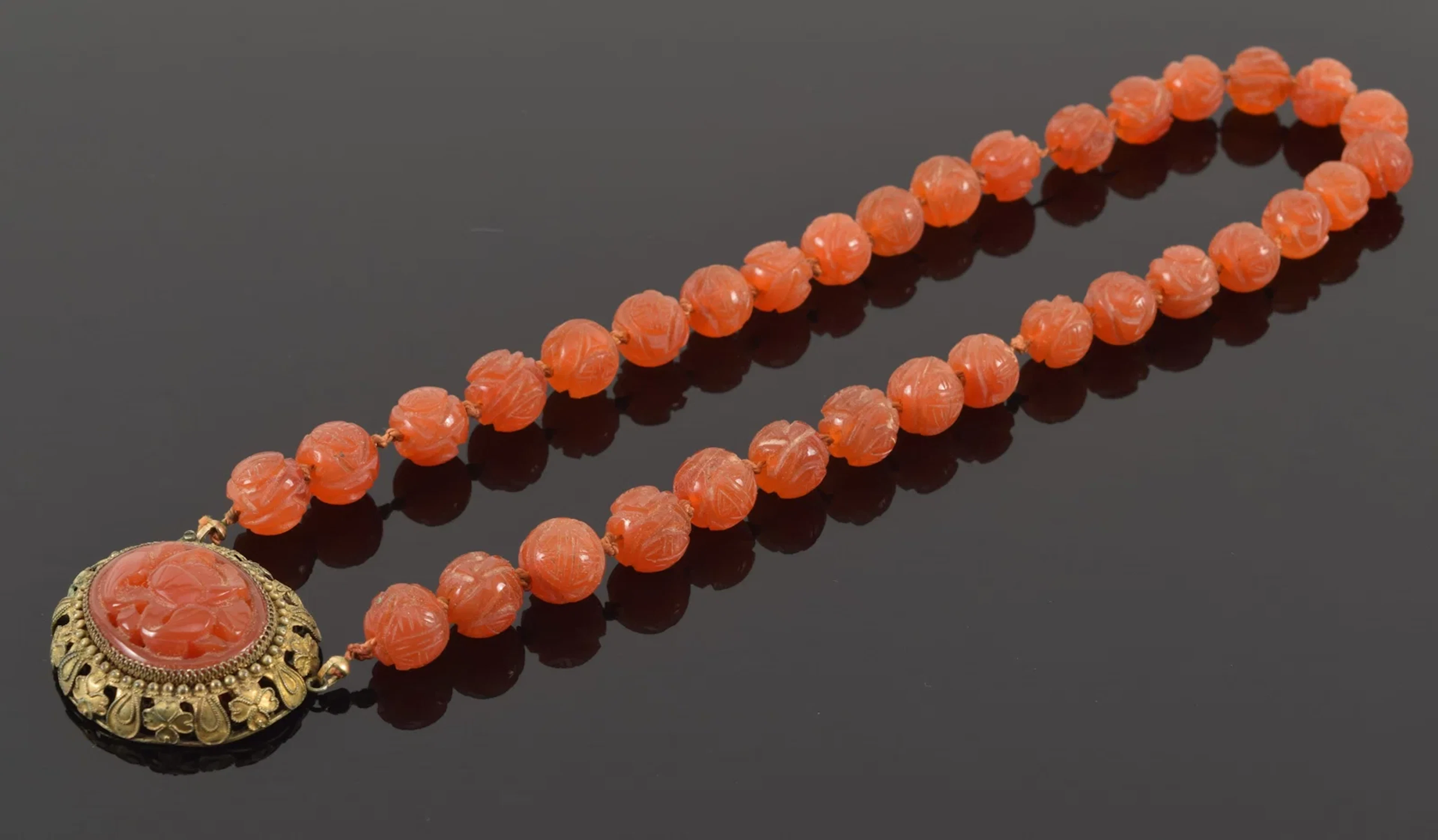 Antique Chinese carved carnelian bead necklace. 16.5in length.