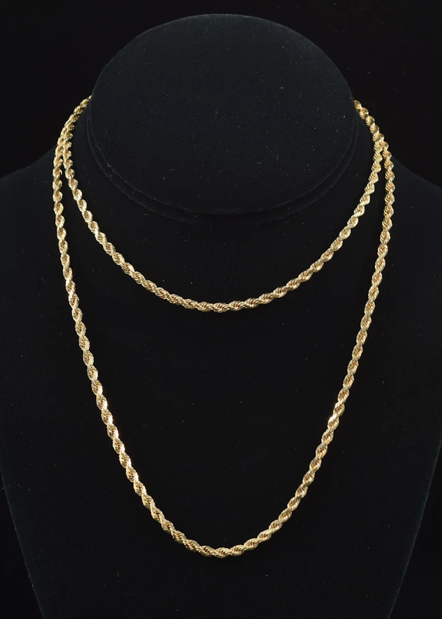 14K gold rope twist necklace. Clasp marked 14K. 30in length. 25.1 grams.
