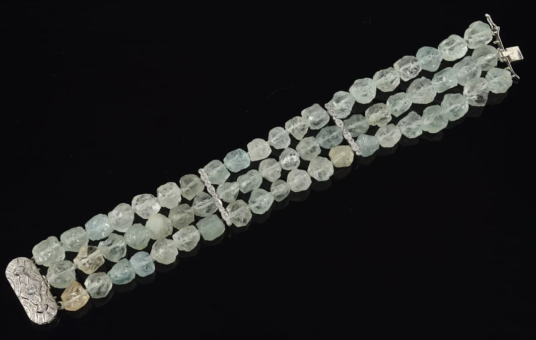 14K white gold rough cut aquamarine and diamond bracelet. 3 strands