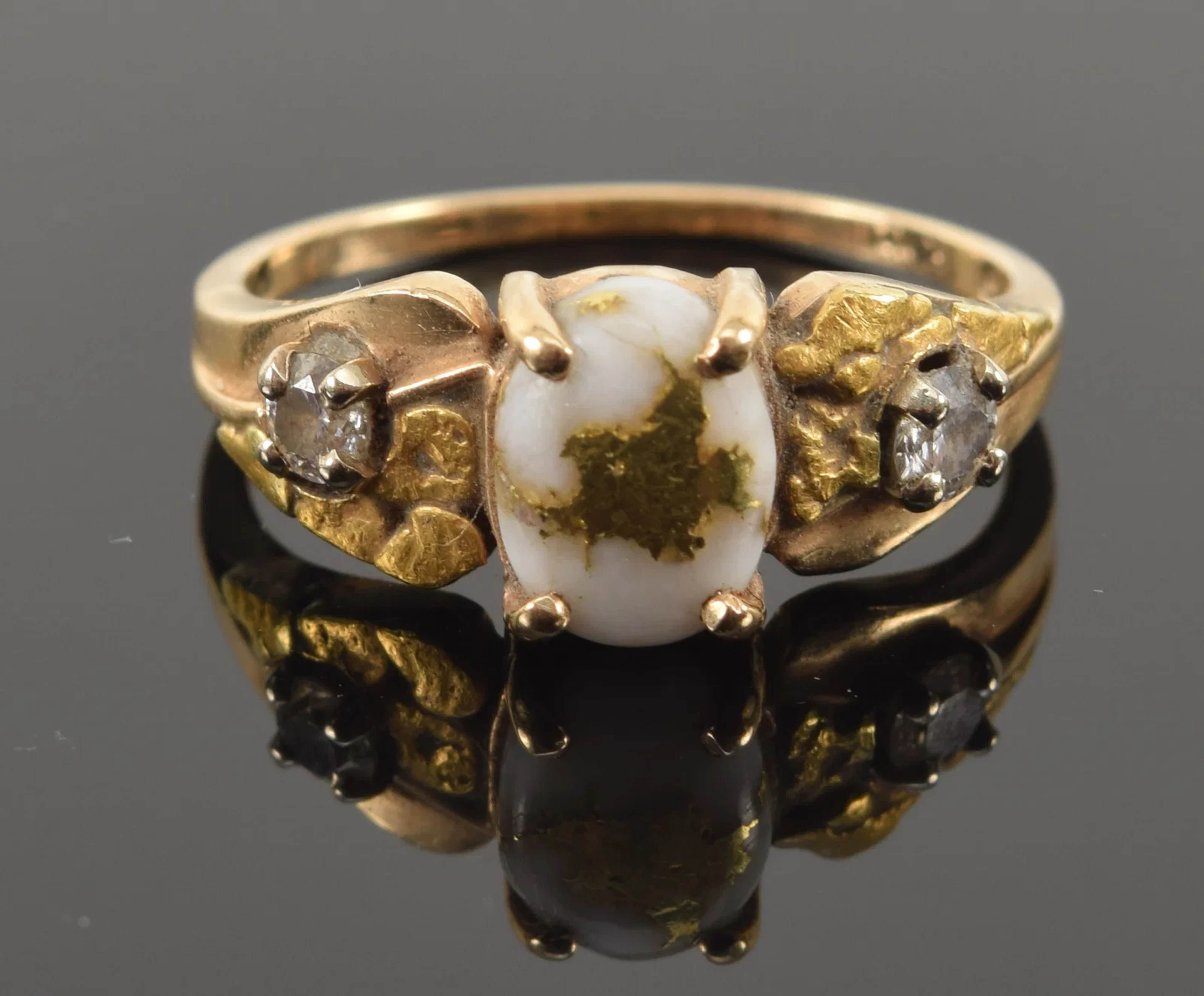 14K gold veined quartz ring. Shank set with small nuggets and round