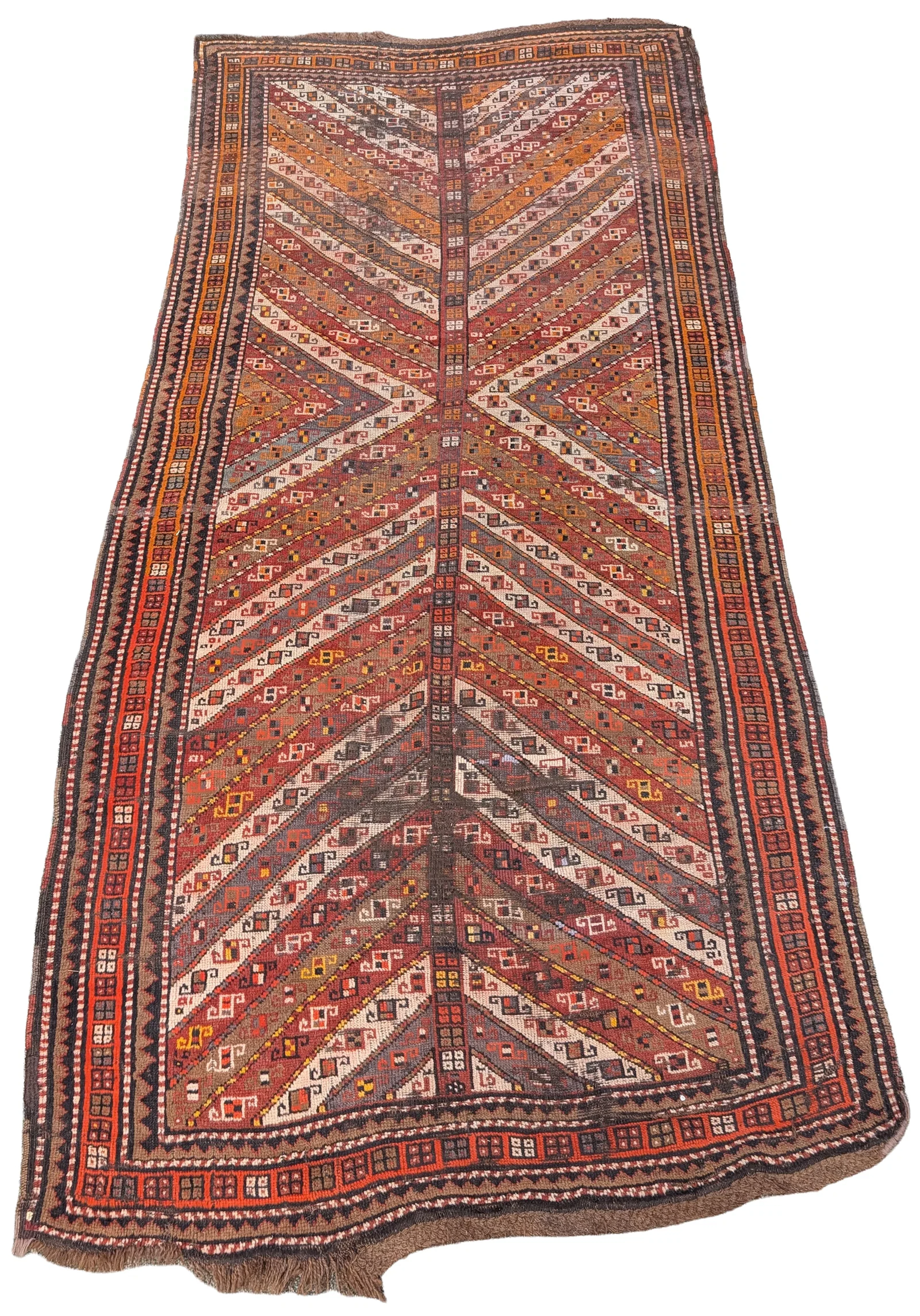 Antique tribal rug, early 20th century. Areas of wear. 107 x 50in.
