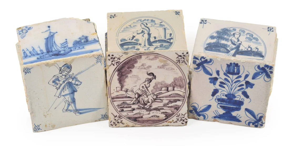 A collection of 25 18th and 19th Century faience tiles in various