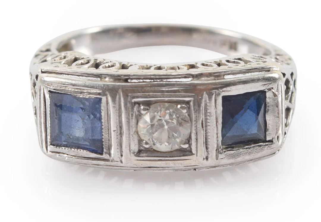 Antique 18K white gold diamond and sapphire ring. Center round cut