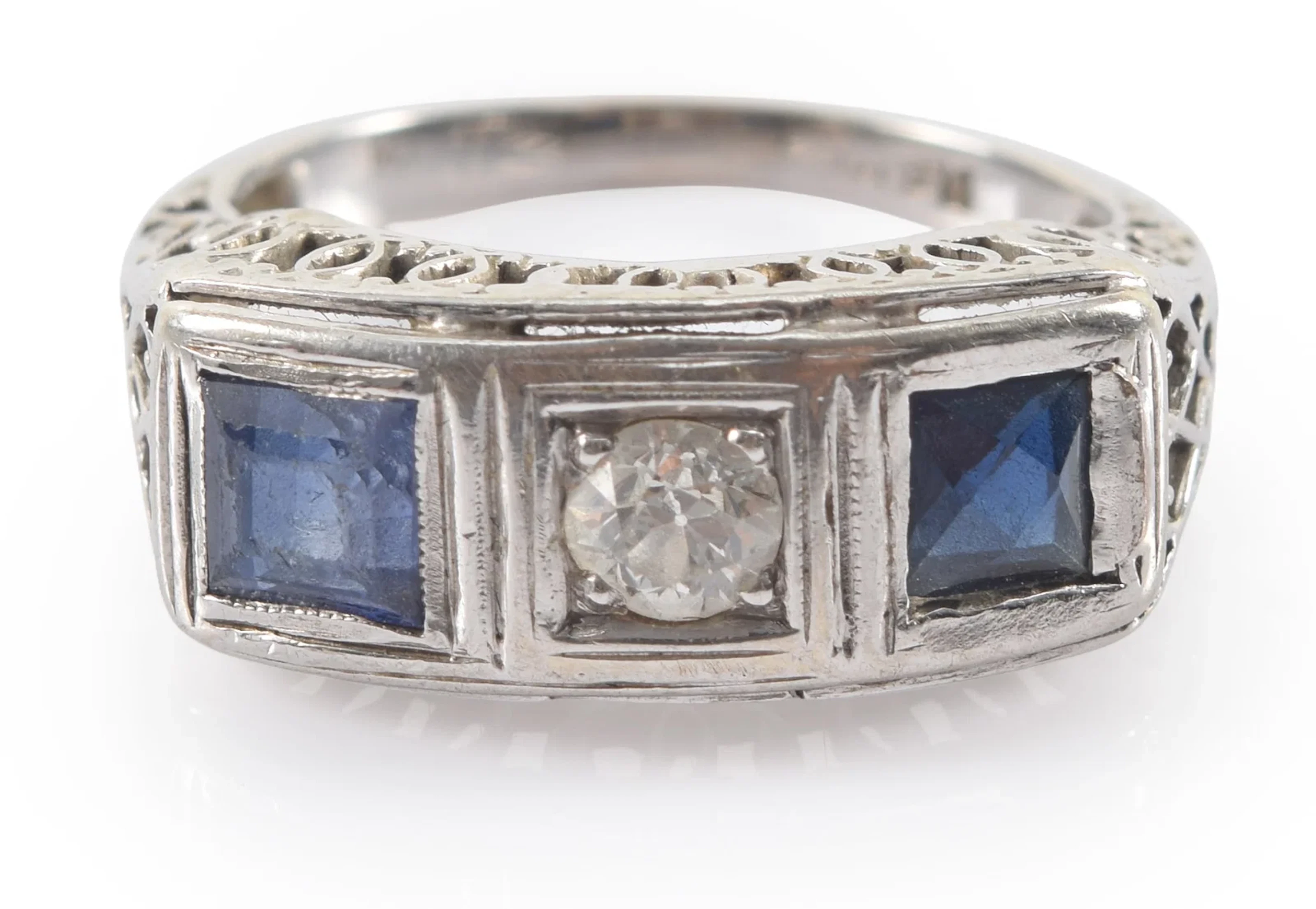 Antique 18K white gold diamond and sapphire ring. Center round cut