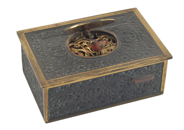 Antique singing bird automaton box. Ornate bronze case with scrolling