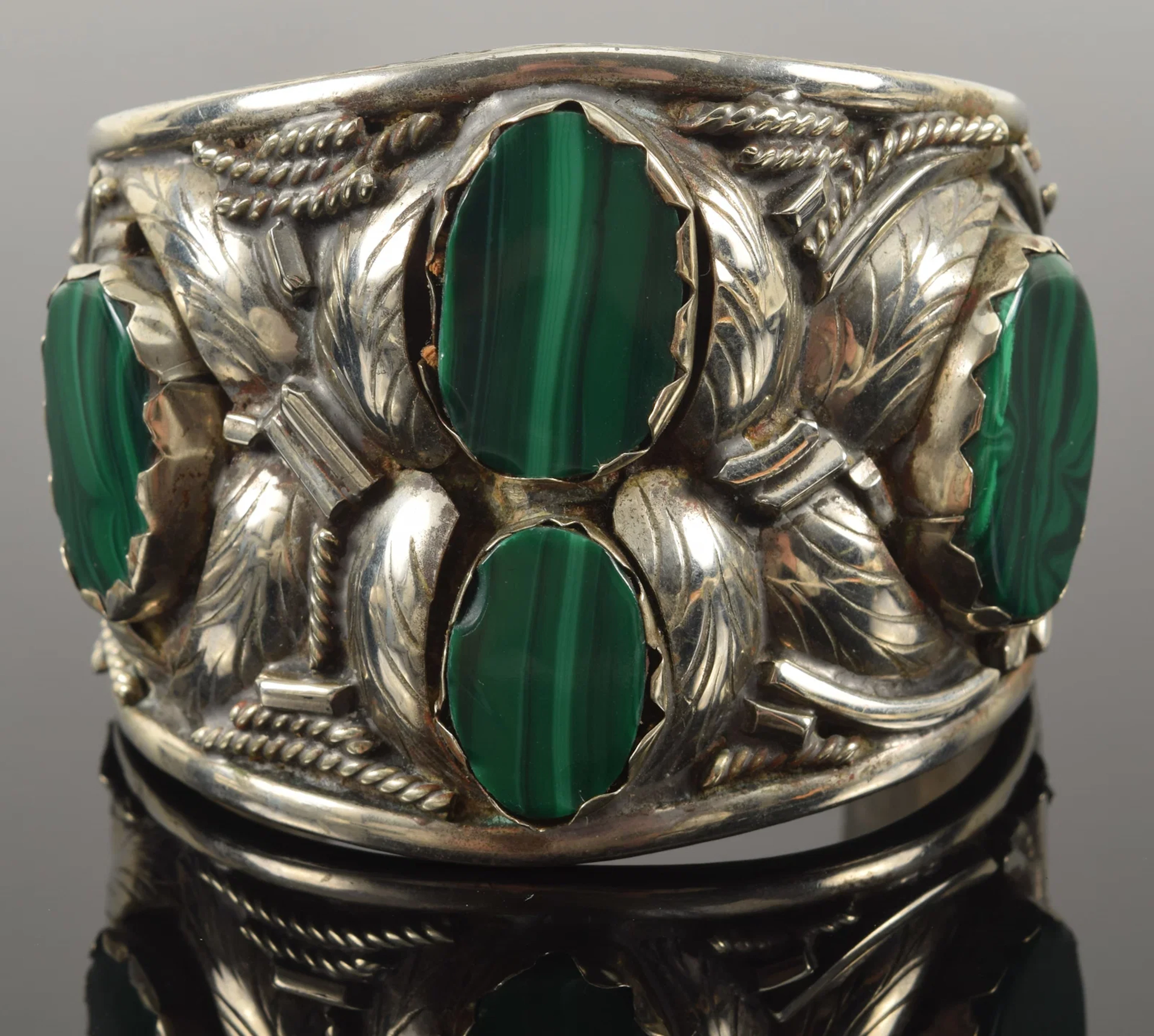 Large silver malachite and onyx cuff bracelet. Raised leaf and shape