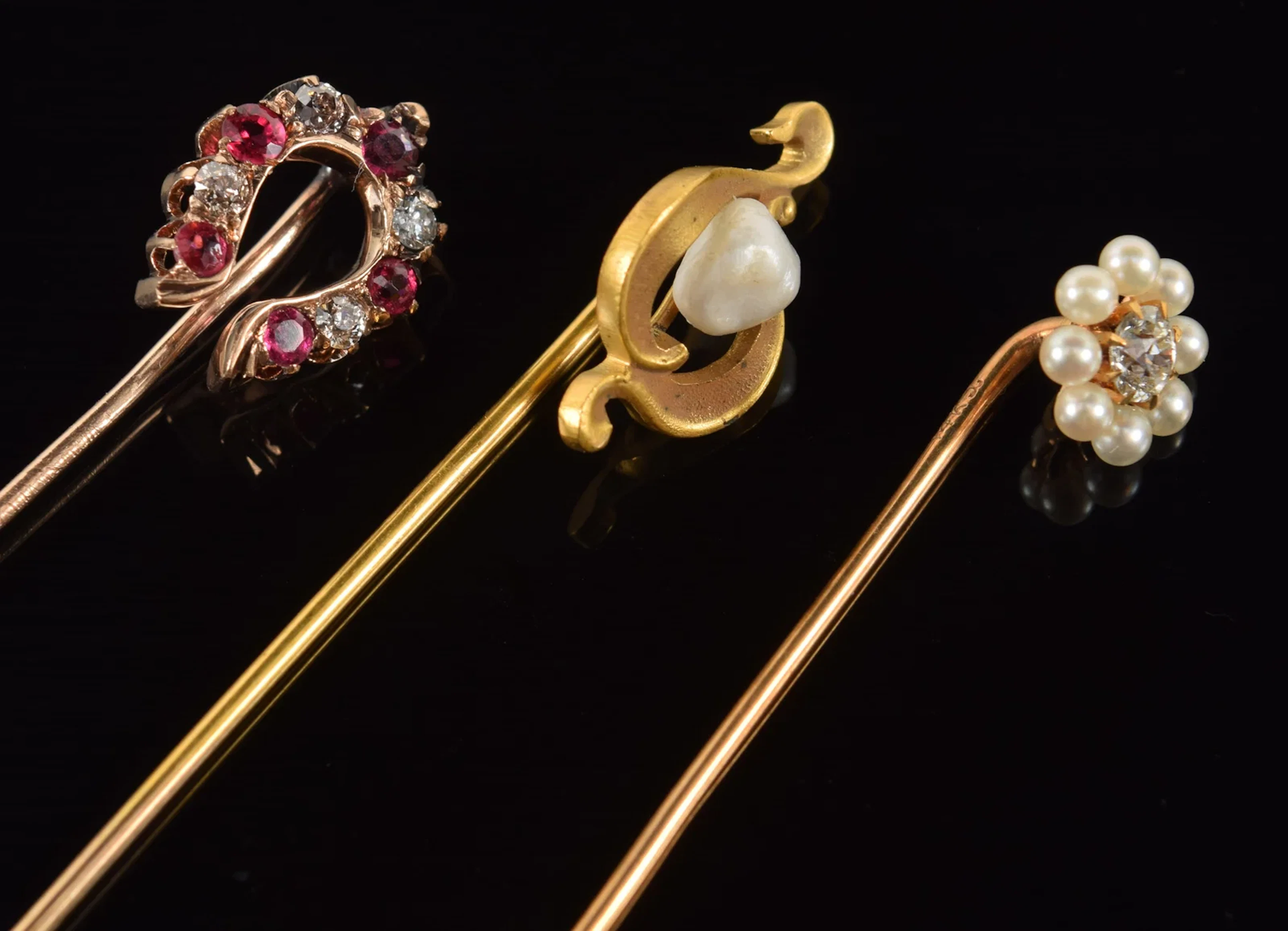 [3] antique 14K gold stick pins. 1) Diamond and ruby horseshoe pin.