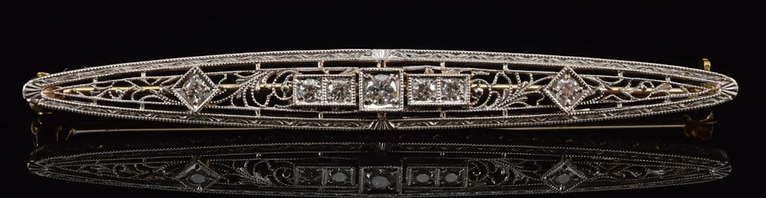 Edwardian 14K gold diamond mounted bar pin. Openwork filigree setting
