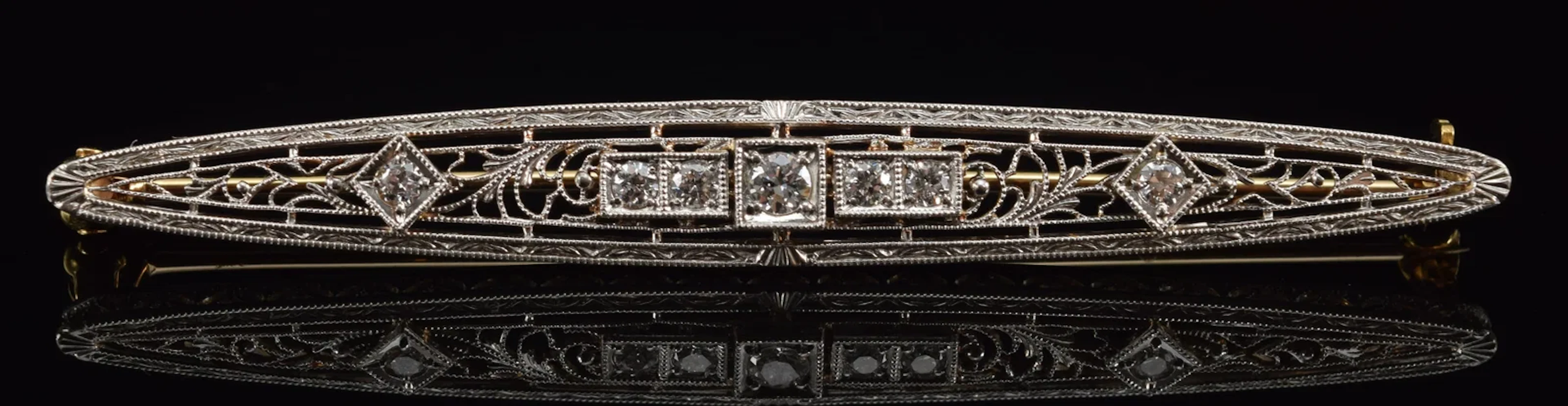Edwardian 14K gold diamond mounted bar pin. Openwork filigree setting